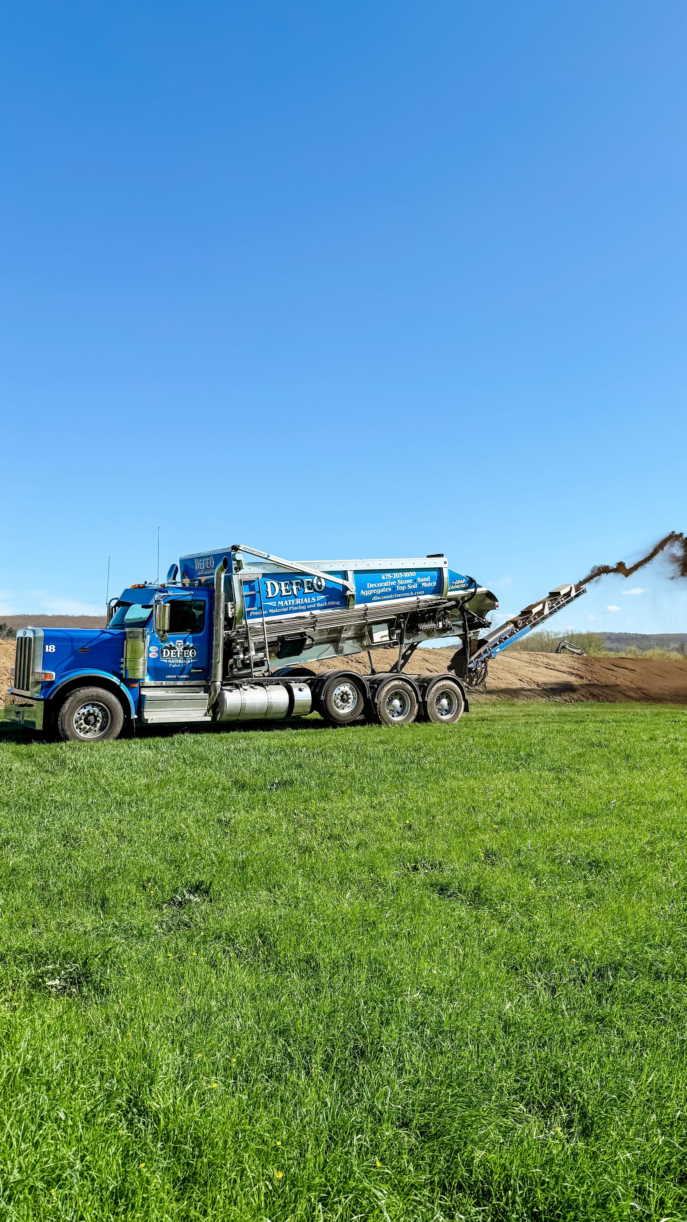 Did you know the Load Launcher can easily spread topsoil?
In this video, we’re distributing topsoil over berms built for flood control. The added layer supports the growth of grass and wildflowers, helping stabilize the soil and enhance the landscape!
We helped this customer cut installation from 5 days to just 1!
#stoneslinger #topsoil #installation
