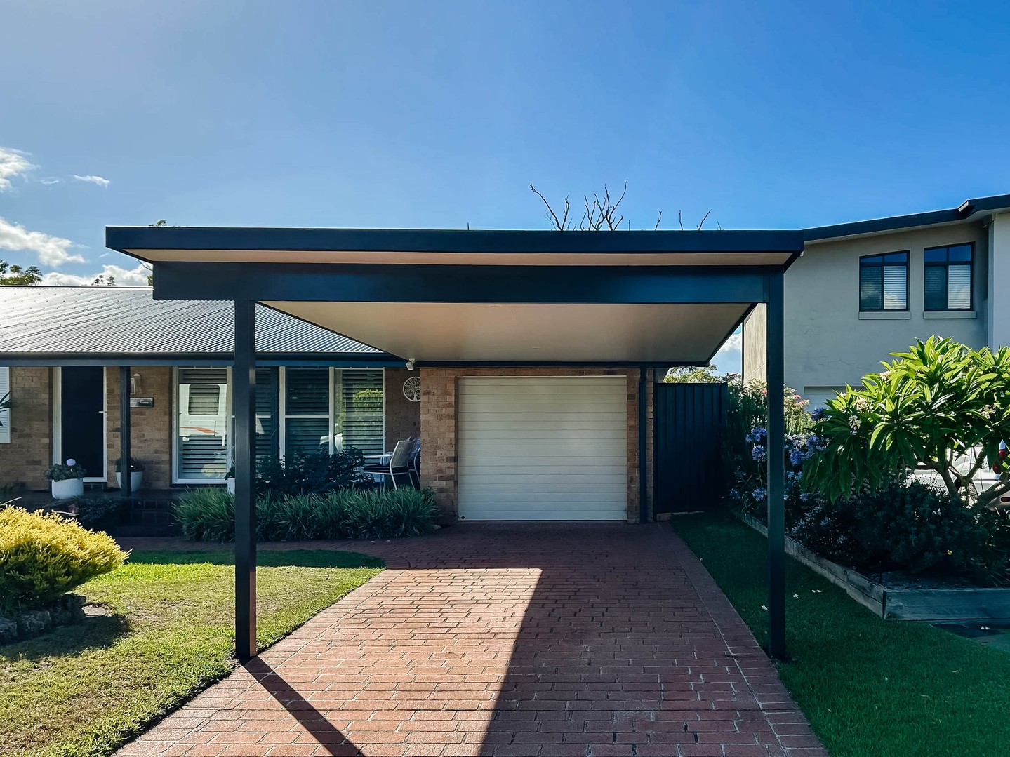 The attached pergola is the simple, straight-forward carport and honestly? We think it's better than a garage. No hassle opening and closing doors, squeezing the car into a small space, worrying about hitting the walls when you open the car doors. Plenty of space to get the groceries out.
That garage could work much harder for you than just serving as a bedroom for your car!
They can be a bit tricky to get across the line with council though, so before you get your heart set on it, you want to check a couple of compliance boxes first.
💫 your carport will sit at least 1m behind the building line of your street.
💫 it will be set back at least 900mm from side and rear boundaries
💫 if your block is >300m, the carport floor area is <25m2
👌Jump through these hoops and you're eligible for the complying development pathway. Phew!
If you can't meet this criteria, you can still try CDC and DA pathways, but be prepared for additional cost and hurdles to jump - and the possibility of a rejection.