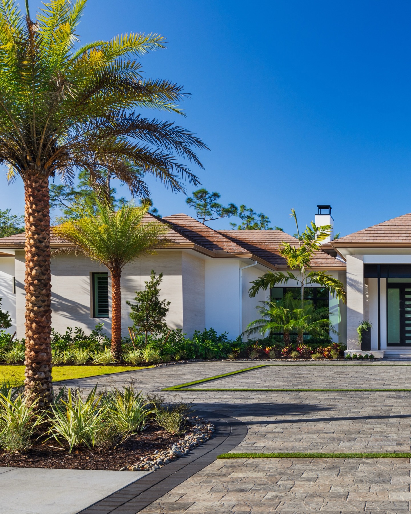 Framed by palms, grounded in texture, and designed for a grand first impression.
This arrival sequence is all about balance. Clean architectural lines softened by layered tropical planting, with a drive that feels both expansive and intentional. Every detail, from the material transitions to the symmetry of the approach, sets the tone before you even step inside.
A true statement of modern coastal luxury.
#LuxuryLandscape #CoastalModern #LandscapeArchitecture #FloridaDesign #HighEndHomes