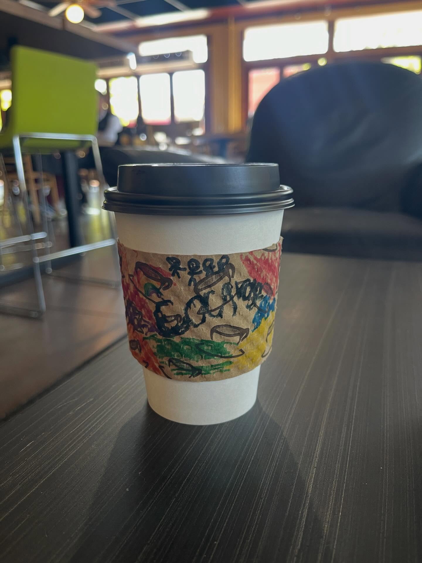 The world is on fire. But local elementary school students decorated coffee sleeves for the coffee shop and I thought you needed to see it, too.