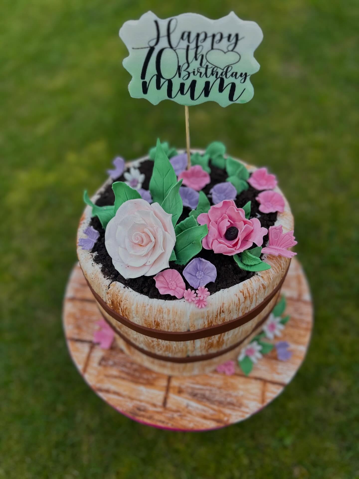 Beautiful garden cake decorated with flowers for an avid gardener celebrating a special birthday #70thbirthdaycake #gardencake #bespokecakes #sayitwithcake #happybirthday