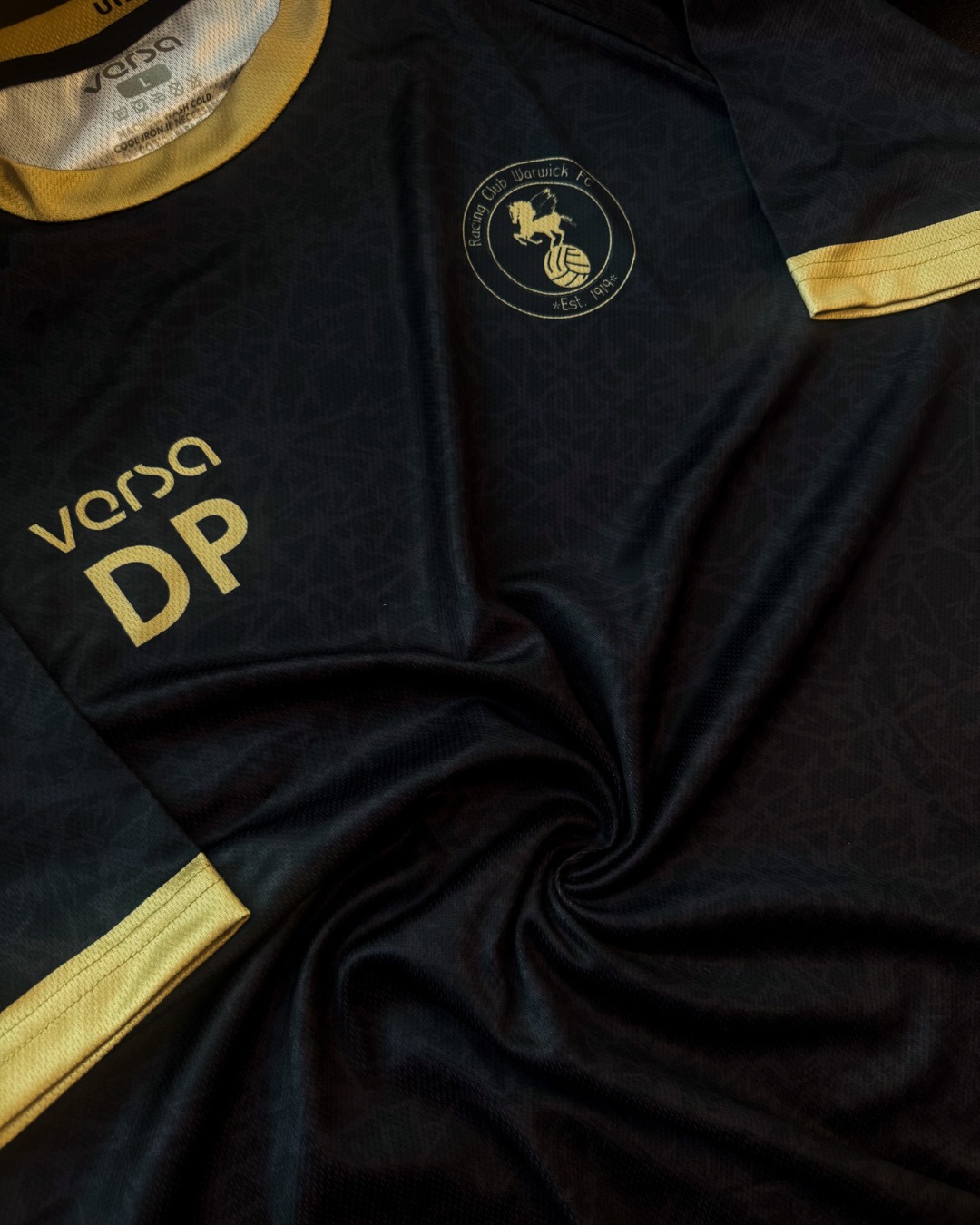 Stealth mode 🖤
A closer look at the limited edition black shirt for Racing Club Warwick… built to stand out under the lights or on the sidelines.⚽️
Clean. Sharp. Unmistakable. 🔥
#VersaSportswear #BespokeKit #RCWFC