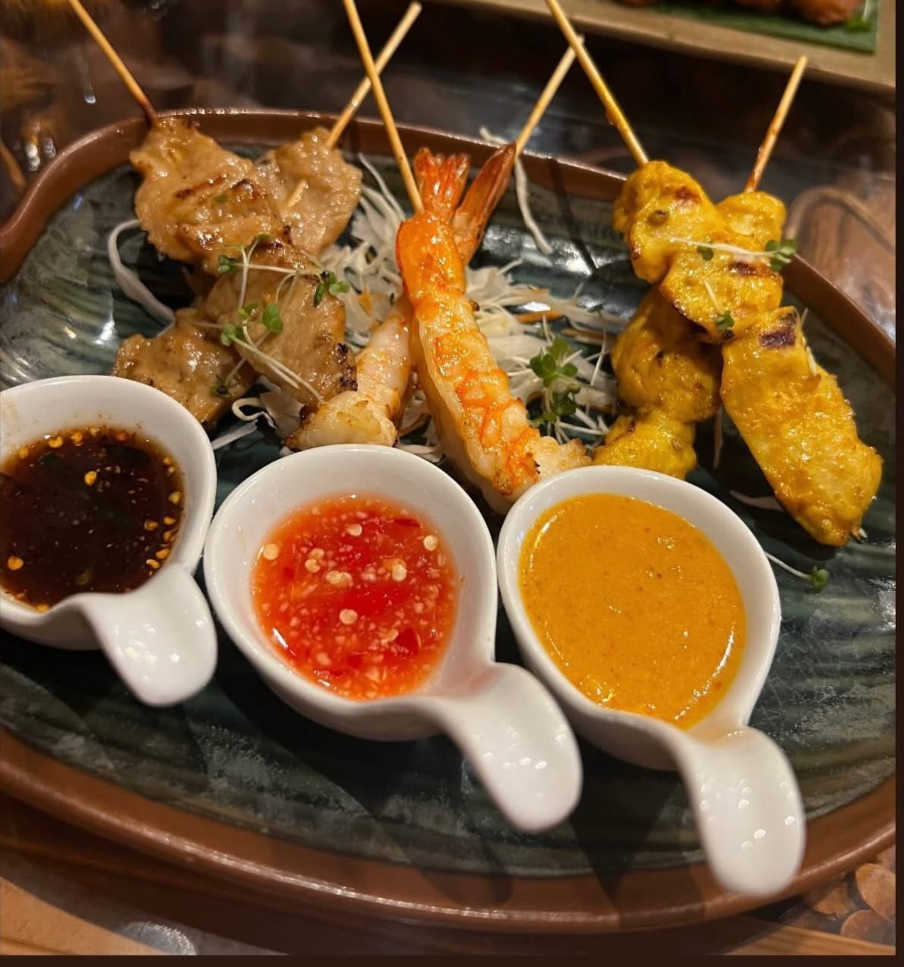 Can’t decide which skewers to go for?
Why not try our Mixed Meat Skewers - featuring Chicken Satay, King Prawn Skewers, and Pork Skewers all on one plate!
Served with three delicious dipping sauces, so you can enjoy every flavour in one perfect dish ✨