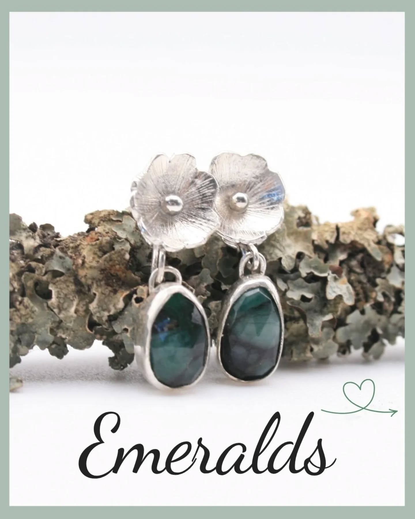 šĀ Emeralds are the birthstone for a May birthday.šĀ Ā
These emerald earrings use irregular slices of emeralds which have lovely dark swirls through the green.Ā They're beautiful stones which I've set in sterling silver and they hang below textured silver flowers.Ā Ā
šĀ šĀ š