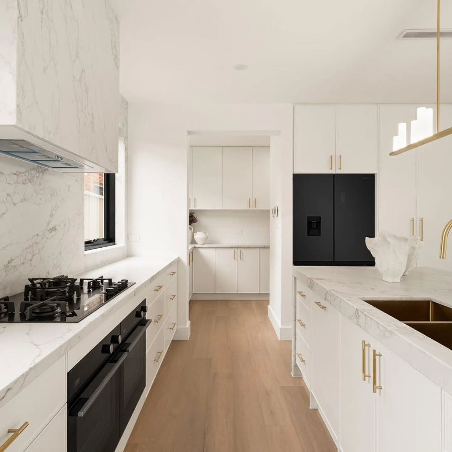 A statement in refined luxury - this custom kitchen is elevated by our AB Grade 15mm Engineered Timber Flooring in Ash Oak, bringing warmth, softness and timeless European Oak character into the heart of the home.
The natural tones of Ash Oak perfectly complement the marble finishes, brushed brass fixtures and light-filled interior, creating a seamless balance between contemporary design and organic texture.
With subtle grain movement and a clean AB Grade appearance, the flooring adds depth and sophistication without overpowering the space.
▫️Colour: Ash Oak
▫️Collection: AB Grade | 15mm Engineered Oak
▫️Board Size: 1900mm x 190mm x 15mm
▫️Install Method: Direct Glue Down
▫️Supply + Installed in-house by @imperialflooringaustralia
▫️Builder: Uniluxe Homes
📍Oatley
Experience the quality of premium engineered timber flooring with samples delivered Australia Wide.
www.imperialflooringaustralia.com.au
IMPERIAL FLOORING AUSTRALIA®️
1 Kennedy Ave Yallah NSW 2530 - Wollongong