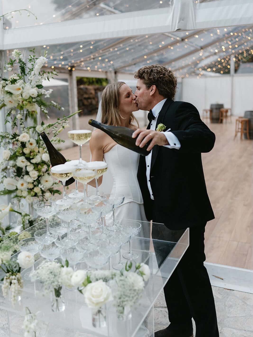 Photos of our arrangements repurposed are always our favourite. While ceremony florals are perfectly styled and haven’t been put through the demands of the day (sun, wind, being moved and admired), there’s something so special about the ‘just married’ love and excitement in reception photos.
Instead of nitpicking a wilted flower or part of the arrangement that’s shifted out of place, we see the slight imperfections that come with repurposing, as proof of a day filled with overflowing love… and all of the chaos that comes with it
If repurposing your ceremony flowers is part of the vision for your special day, we’d love to chat about how we can help, enquiries@irisandelle.com.au 🤍
