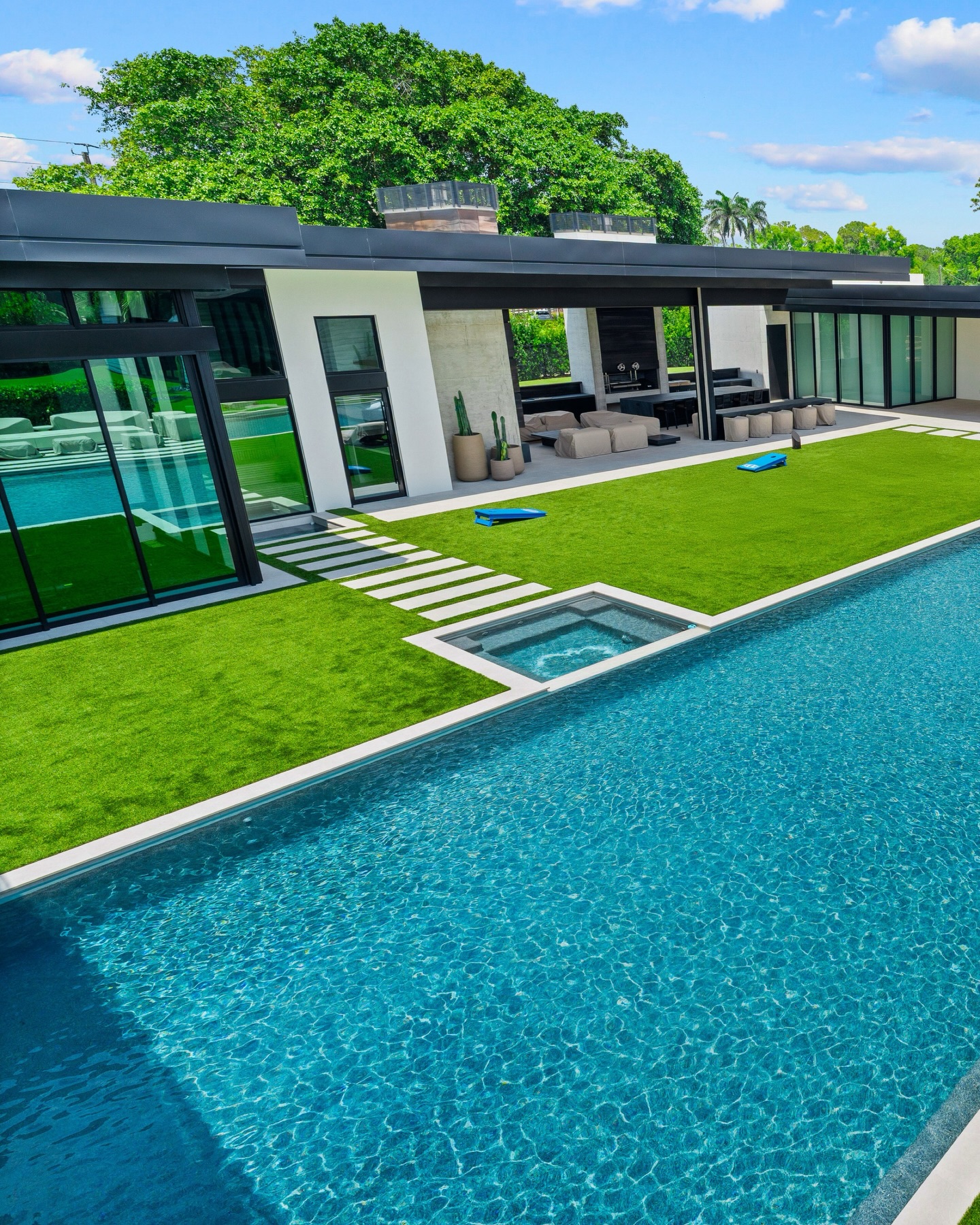 So much room for activities!
A private outdoor estate designed for movement, entertaining, and effortless luxury. Expansive turf courts, a sleek resort-style pool, integrated spa, and architectural lines that make every square foot feel intentional. Built for sunny afternoons, evening gatherings, and everything in between.
Modern landscape architecture that turns a backyard into a lifestyle.
#NaplesFL #LuxuryLandscapeDesign #ModernOutdoorLiving #PoolDesign #FloridaLiving