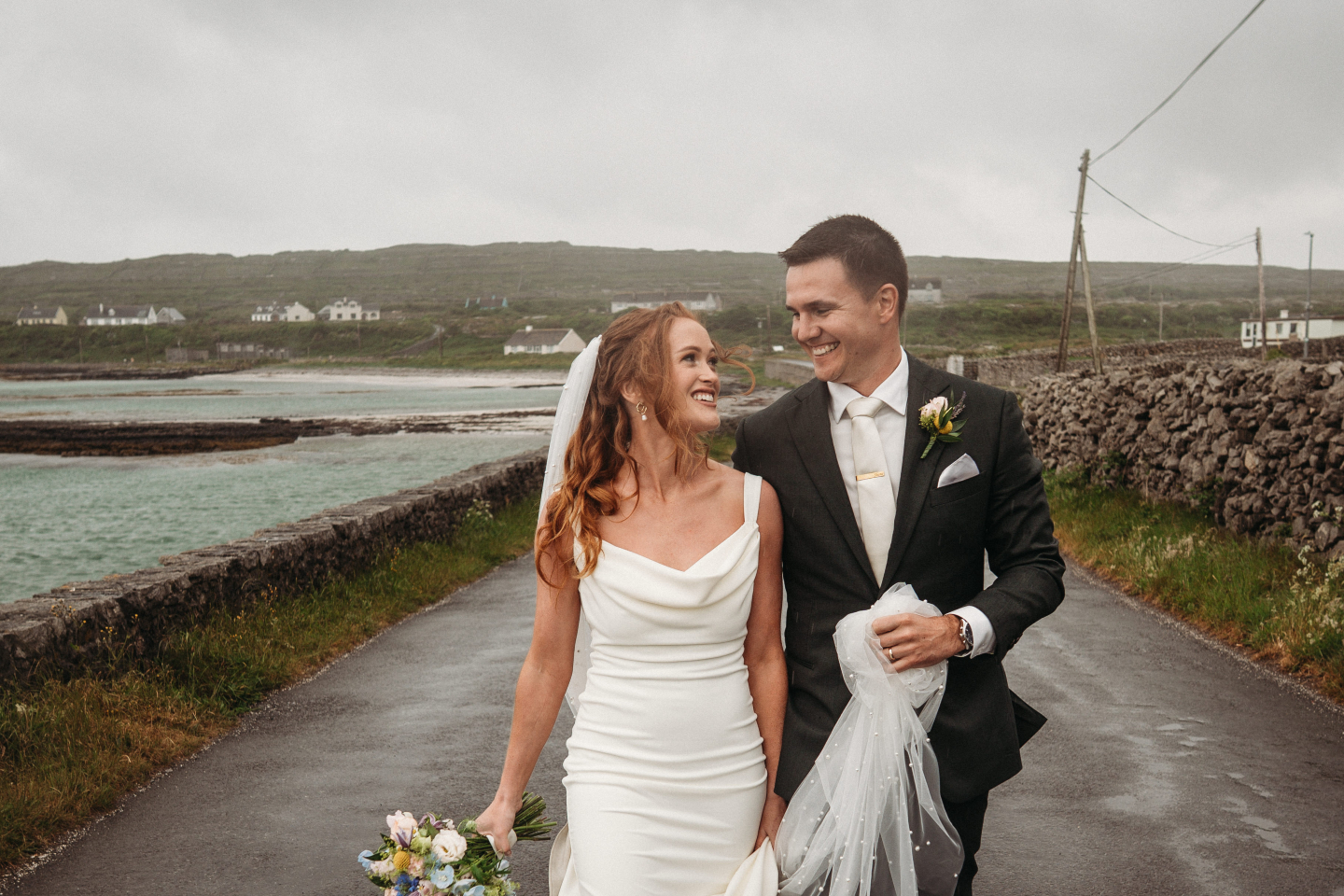 Beautiful words from a beautiful couple, Maria and Shane.
We had the greatest experience planning our wedding with The Aran Islands Hotel. Niall and his staff were always so accommodating. We planned our wedding from Australia and Niall had sisters and mothers and everyone in between to deal with on our behalf. Niall was on the other end of the phone whenever we needed him. The weekend went off without a hitch.
The entire staff was exceptional to all our guests. Many had flown from way across the world to be there. Everyone at the hotel went above and beyond.
The wedding day was wet and wonderful, adding to the wild west appeal. Throughout the entire day Niall was there hyping us when we needed to be hyped and calming us when the rain came and we were on a cliff edge. Honestly could not have asked for a better team to look after us on our wedding day. A dream destination.
