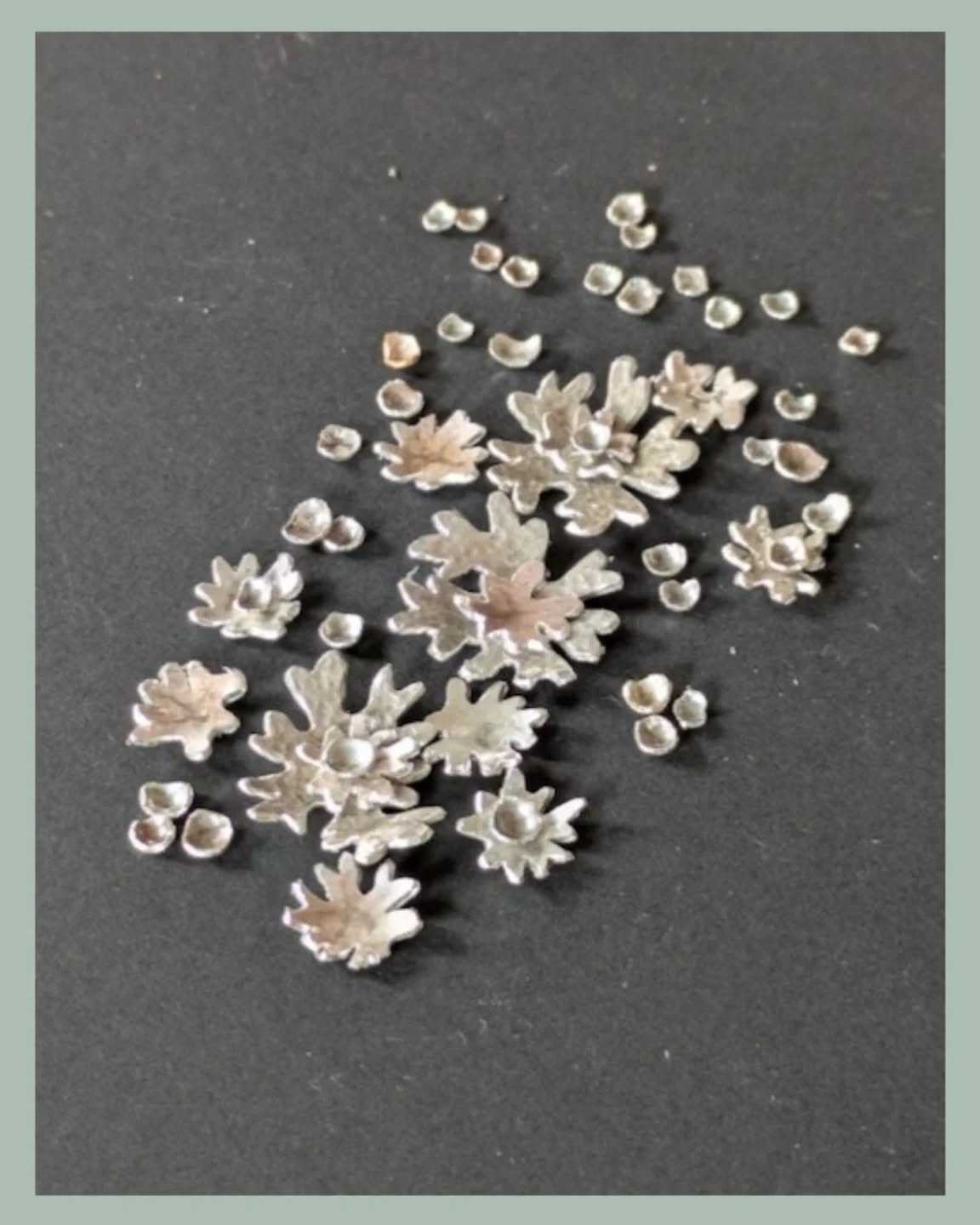 My new lichen pieces are slowly progressing.Ā At the moment I'm cutting out lots and lots of lichen shapes in various sizes.Ā It's quite fiddly and I seem to spend a lot of time dropping them and then searching for them on the floor.Ā Ā š