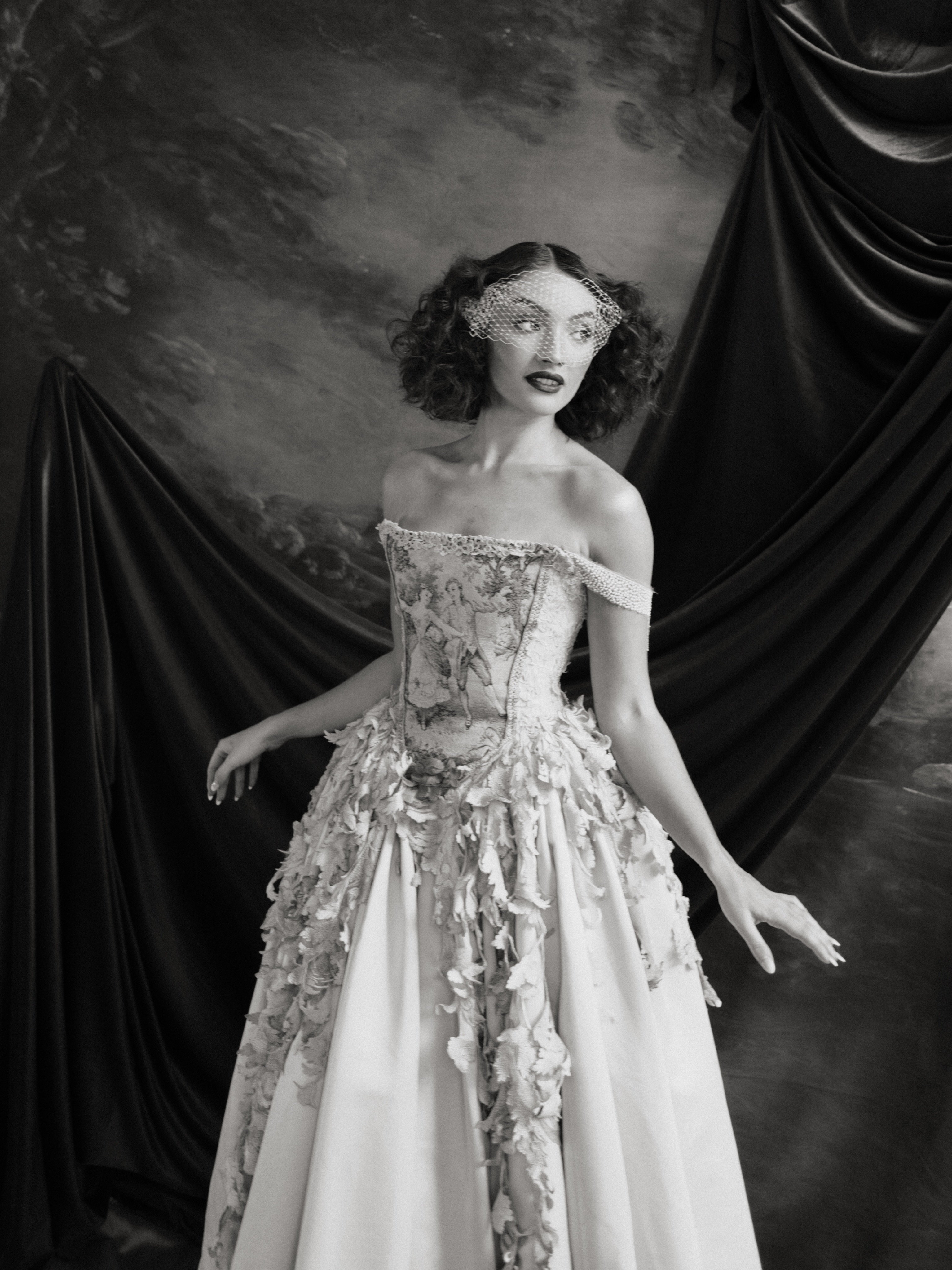 .
Dear Estelle
You feel like a costume from a forgotten stage romance ~something once worn beneath lights and velvet curtains, where every entrance carried the weight of a story already half in love with itself.
The Estelle gown is made from warm caramel satin draped softly. Trailing scrolling leaves wind across the surface like echoes of a scene that never left the stage. At the bodice, a vintage tapestry sits like a relic of lovers dancing.
Everything about you feels collected rather than made… from backstage dressing rooms scented with powder and silk, from candlelit opera houses where music lingered in the air long after the final note, from crumbling balconies where stories once unfolded behind heavy drapery and golden dust. A romance that refuses to disappear, even after the applause has faded.
A creative piece, named ESTELLE, created for @jennifermoher as an ode to theatrical beauty -where fabric becomes stage, and every detail carries the echo of a forgotten performance 🤍
.
.
The Creative Team:
Concept and Photography @jennifermoher Planning and Styling @coorieweddingplanning
Video @peakandcoast @journalweddingfilms
Gowns @julita_ldn_bride
Venue @lyceumedinburgh
Lovers @estelleandyounes
Makeup @raemathiesonmakeup
Hair @meiganalessandrabridalhair
Draping @maedaeevents
Stationary @lauraelizabethpatrick
Cake @yishicake
Suit @fallenherostore
Film scans @allthingsfilm.ca
.
.
.
.
.