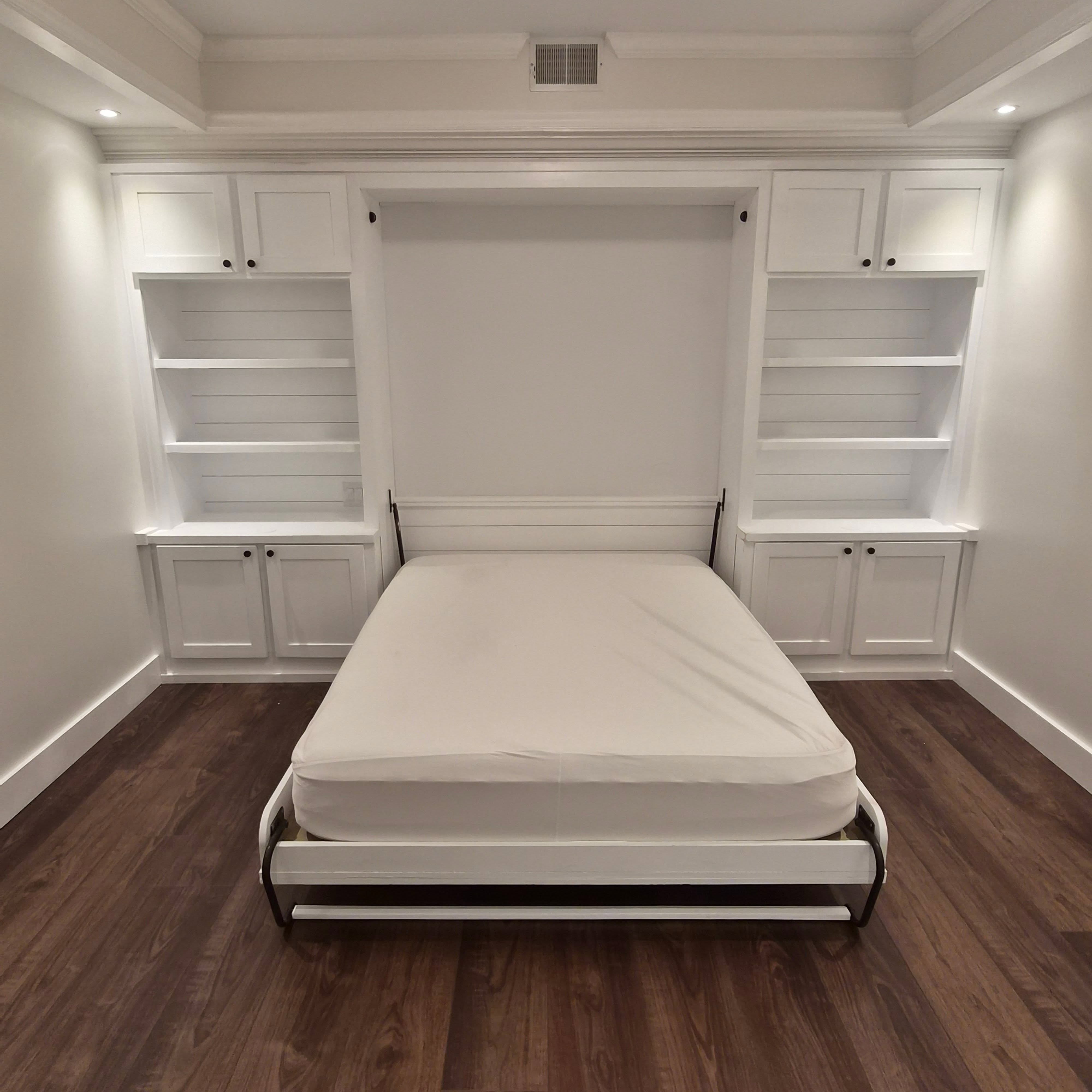 Finishing up this amazing basement project in Greenfield this week. So many amazing details in each room. The murphy bed was built custom for the space. Each side table has a wireless phone charger built into the counter along with pop up outlets. The 3 inch recessed lights in the tray ceiling really give the bedroom its ambiance.