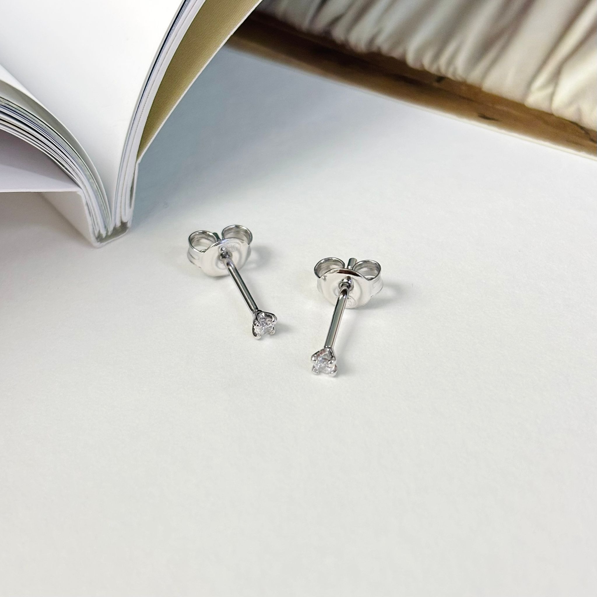 925 silver tiny CZ stud earrings in a simple everyday sparkle design.
