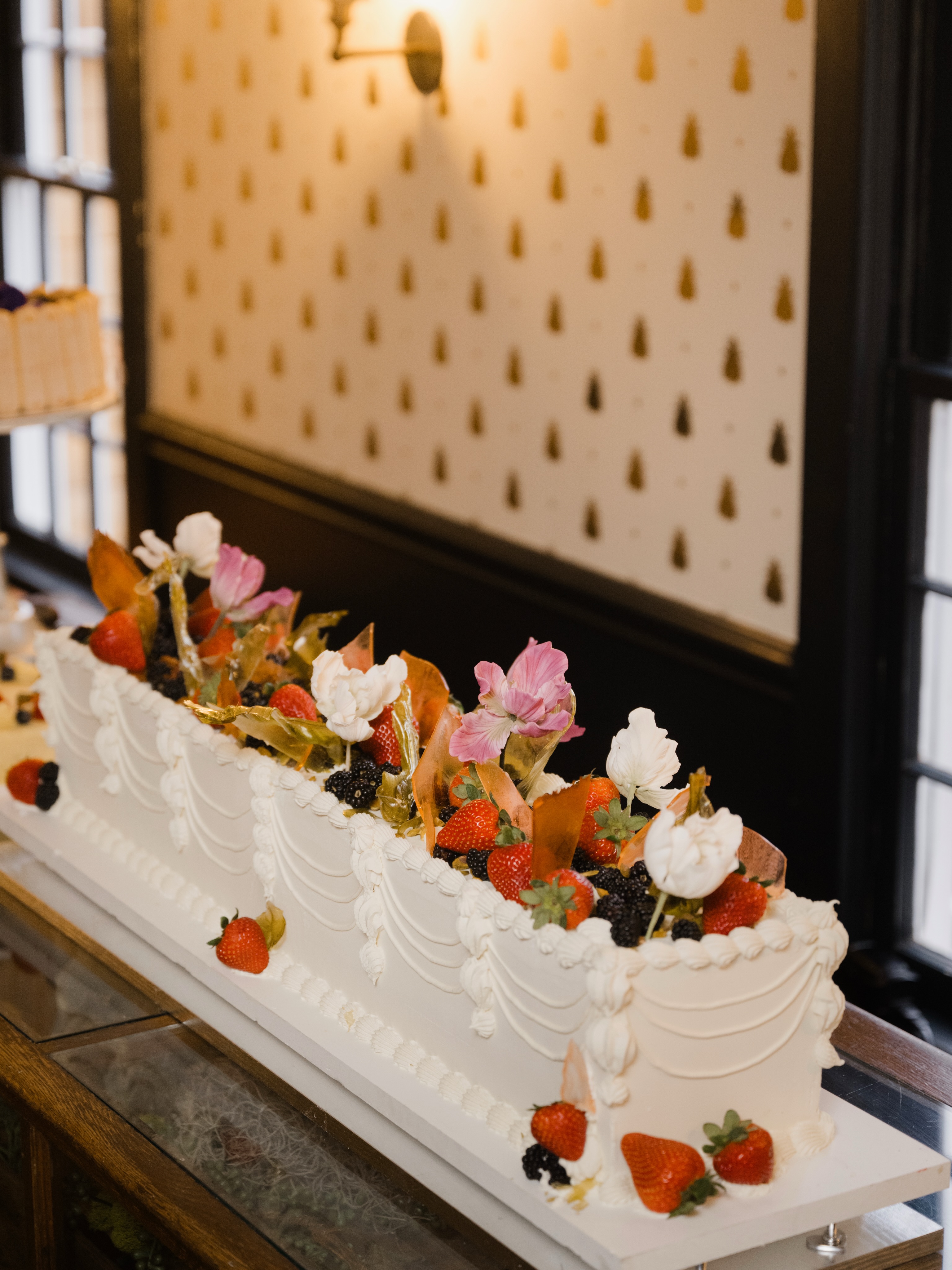 For a couple who really, really loves cake - the cake became a moment. 🍰✨
An incredible 3-foot-long cake designed by Victoria at Vici Designs, covered in fresh fruit, cascading sugar flowers, and all the drama in the best way possible.
Planning & Design: @allsettup
Venue & Catering: @the_redding_roadhouse
Photographer: @erincoveycreative
Florist: @rootsandthreadco
Entertainment: @book_djsean
Hair: @danabartoneweddings
Makeup: @jkinfordbeauty
Smaller Details & Signage: @purelythedetails
Cake Designer: @vicidesignny
Baked Goods: @fattoamanobakeryct
Custom Chocolate Bars: @tonyschocolonely_us
Custom art (Save the Dates, Chocolate bars, Painting): @Burger_babie
Dresses: @Chachalindavtg
Dress alterations: @Sewcatskills
Groom’s custom suit: Zemosmensstore.com
Chair Rental: @elitepbstentsevents
Tent: @chatfieldtruevalue
Bride: @ame.irc
Groom: @justinterstellar
Fairfield County Wedding Planner | Destination Wedding | Luxury Wedding | CT Wedding | Fairfield County Wedding Planner | Hudson Valley Wedding | Event Planner | CT Event Planner | Litchfield County Wedding Planner | Destination Planner | All Sett Up Events