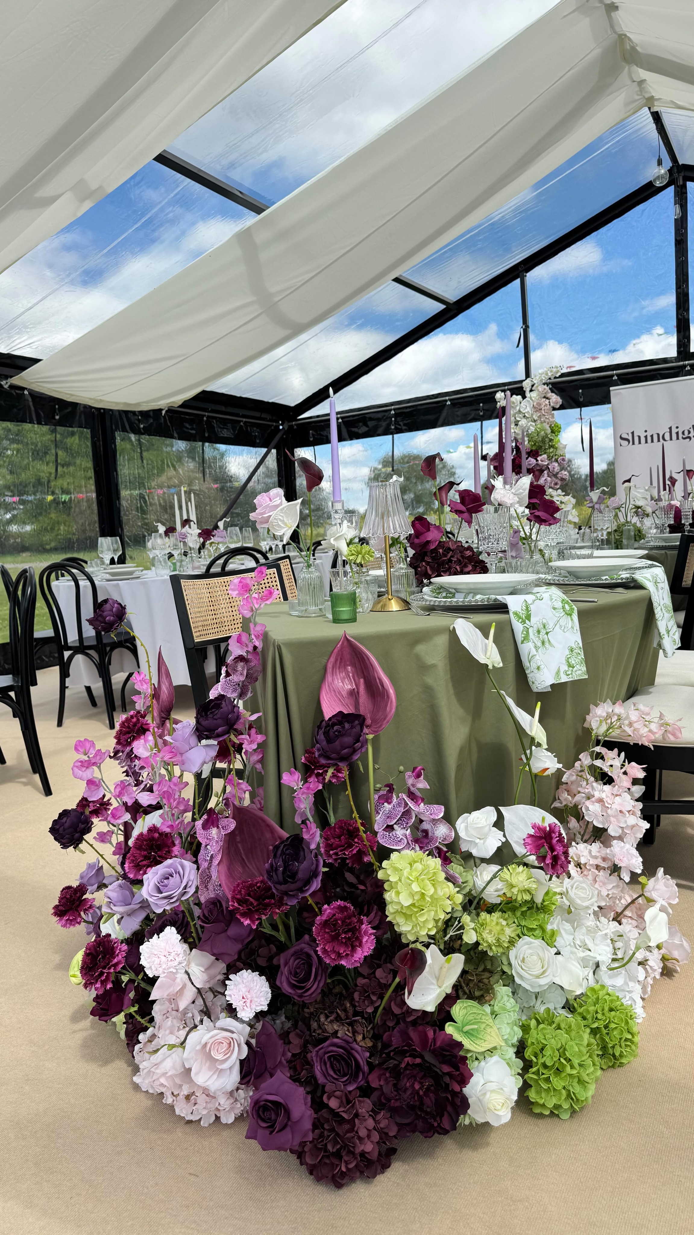 Serpentine Table! Oh my how we LOVED getting our hands on our very first serpentine table this weekend 💕💕💕 Lots of bud vases filled with rose and calla lilies, a mix of tall and low candles, dotted with our new glass table lamps, the most divine glassware from @yes_hire , clear beaded chargers and a colour palette of plum, whites, fresh greens and a pop of hot pink. We just didn’t want to take it down!
Chairs, serpentine table hire, & tableware by @yes_hire
Beautiful clear marquee by @countryside_events
Gorgeous Location: @escrickparkestate
Awesome wedding fair @lovedupnorth
Thank you to everyone for the opportunity, we LOVED it!
#yorkshireweddingstylistandflorist #yorkshireweddingfauxflorals
#yorkshireweddingflorist
#serpentinetablescape