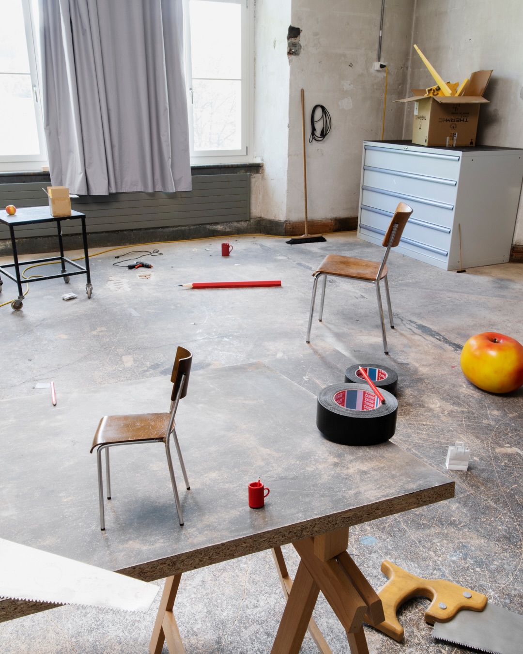 Studio. Blending Model With Reality
At first glance, the images appear to show an artists’ studio, that of German-Swiss artist duo Cortis & Sonderegger, with its clutter of everyday objects. Yet, suddenly, perspective shifts—large things appear small, and small ones appear impossibly big. In Studio, Jojakim Cortis and Adrian Sonderegger play a sophisticated game with and about the authenticity of photography. Boundaries between the genuine and the fake become blurred.
Cortis & Sonderegger built a detailed model of their workspace near Zurich complete with much of its furnishings, of which they took countless photographs. These images turn our viewing experience upside down and invite us to take a closer look. The artists’ play with reality becomes visible on various levels: the view from the model’s window shows the real studio space; proportions look weirdly distorted; and occasionally, Cortis & Sonderegger themselves appear as protagonists. In today’s world, with myriad images produced every day, Cortis & Sonderegger’s Studio series constitutes a counterpoint to the latest developments in photography and artificial intelligence-based image generation.
***
By Jojakim Cortis and Adrian Sonderegger
@cortissonderegger
Book design by Bonbon: Valeria Bonin, Diego Bontognali and Janiva Wittmer
@bonbon_zurich
Printed by DZA, Druckerei zu Altenburg, Thuringia
@dza.druck
#scheideggerspiess #experimentalphotography #cortissonderegger #perceptionisreality #swissphotographerduo