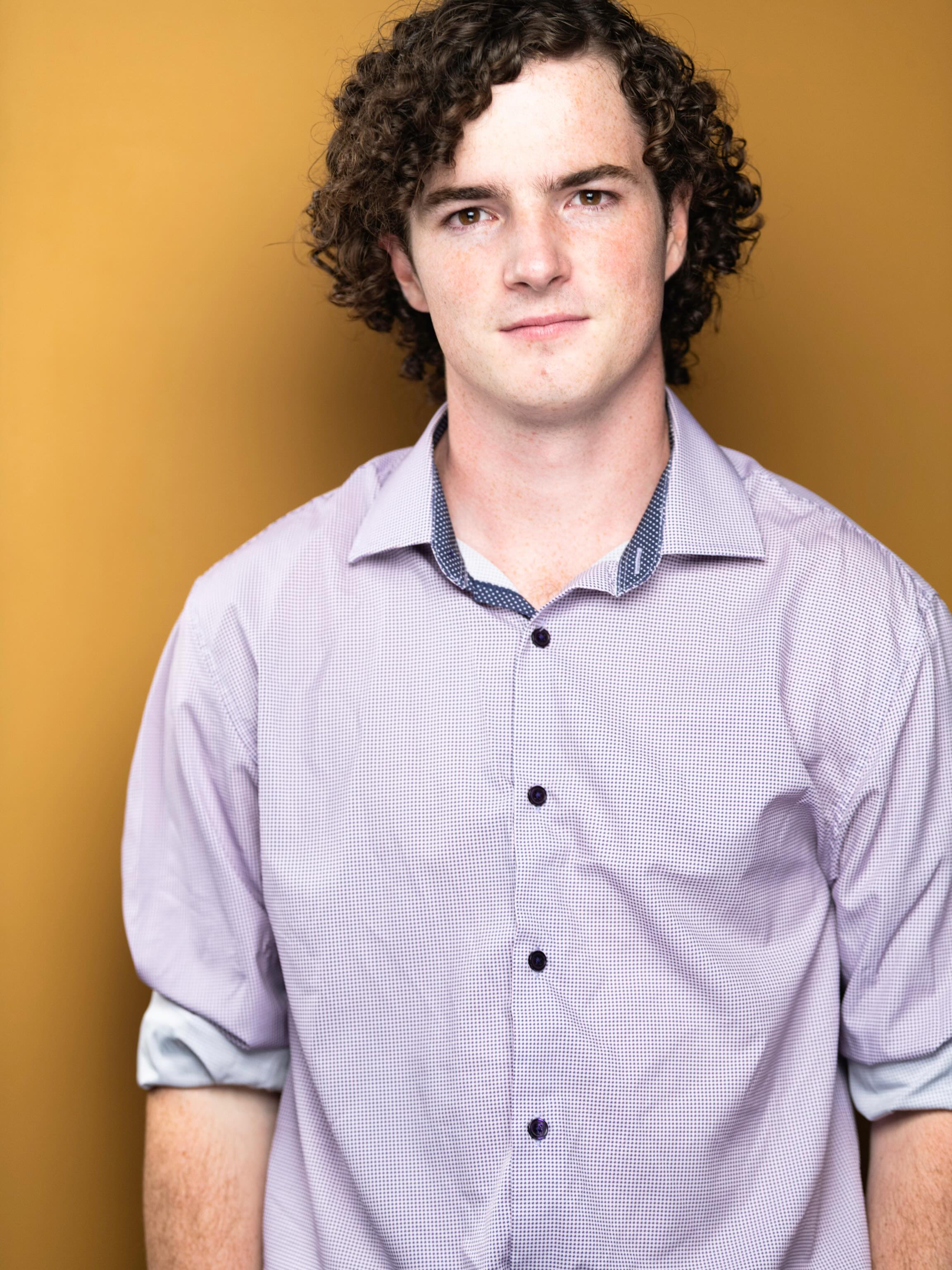 Senior Spotlight!
Clayton Miller is an actor, singer, writer, and sound designer, and former President of Sarah Lawrence Music Festival (SLMF) and Producer of Musical Theatre Ensemble (MTE). He has been involved in 14 productions during his time at Sarah Lawrence, including 10 as a performer, and helped organize 30+ concerts for SLMF. Treasured SLC roles include Schultz in Circle Mirror Transformation, Brad Majors in The Rocky Horror Picture Show, The Astronomer in Ghost Quartet, Jerry Goss in Bug, Malvolio in Twelfth Night, the devised piece How We Lived in Lockdown, and behind-the-table work as the Sound Designer for A Midsummer Night’s Dream and Georgia Mertching Is Dead. In the last year, he has found specific joy in creating his own performances (through courses such as Ethan Philbrick’s Archives, Experiments, Interviews, & Data and Benjamin Zender’s Trash!), a passion he wishes to nurture post-grad.
Headshot Photo: Mia Isabella Photography