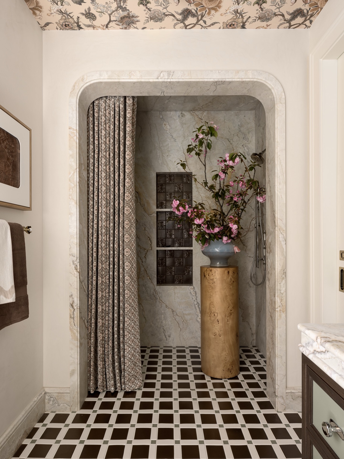 A moment framed in stone.
The arched entry reveals a richly layered composition - gorgeous stone from @davincimarble , brought to life through the exceptional fabrication and installation by @aguilartile . The natural movement of the slab sets the tone, anchoring the space in quiet drama.
At the center, a striking floral arrangement by @mflora.design sits within an alabaster glass vessel by Sophie Lou Jacobsen, sourced through @thefutureperfect - a sculptural moment that softens the architecture.
The shower curtain, crafted by @dawson_workroom in sumptuous Ardecora jacquard velour from @zimmerandrohde via @hewnsf , introduces texture and movement, while the bas-relief tone-on-tone checkerboard tile within the niche and the geometric floor tile by @mcintyretile create a rhythmic, graphic counterpoint. Polished nickel plumbing fixtures by @kallistadesign add a timeless layer of refinement.
Lime plaster by @coloratelier washes the walls in a soft, luminous finish, enhancing the depth and quiet elegance of the space.
Project: Birds of a Feather @sfshowcase
Design: @sonomainteriors
Build: @dotto_company
Photography: @tim.d.coy.photography
Stylist: @lucybamman
#BirdsOfAFeather #SFDecoratorShowcase #SonomaInteriors #InteriorDesign