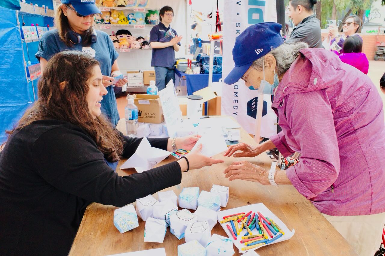 Scenes from a booth! Our “Cold Tofu” origami activity booth was filled to the rim yesterday! Thanks to all who stopped by!