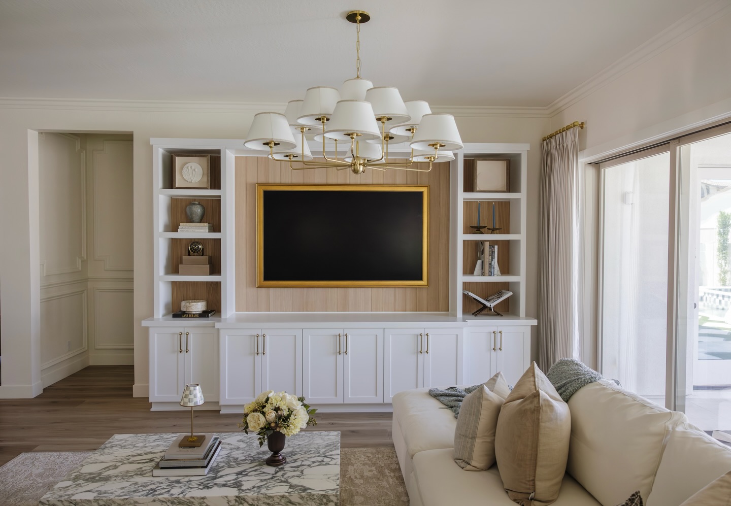 Swipe for the before→ because this one came a long way.
The bones were there, but the room needed warmth, layers, and a stronger focal point.
We added custom built-ins, statement lighting, layered textiles, warm wood tones, and styling that made the space feel finished without feeling overdone.
Now it feels calm, polished, and actually lived-in🤍
↓ Save this for your living room inspo & tell us your favorite part of this space!