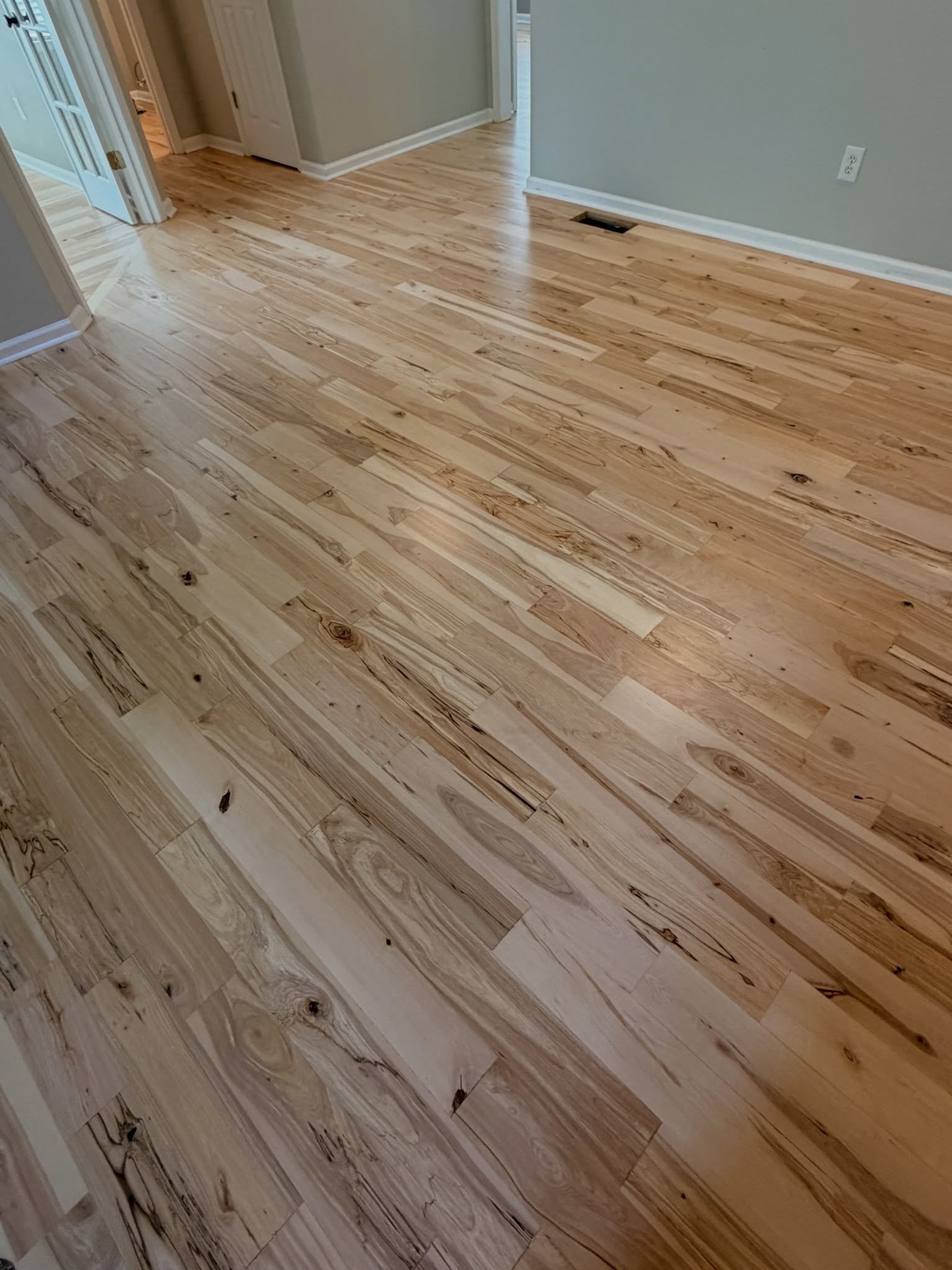 Stunning solid birch floors sanded new again. Previously factory finished with distressed hand scraped and deep febbles. The end result was nothing but spectacular