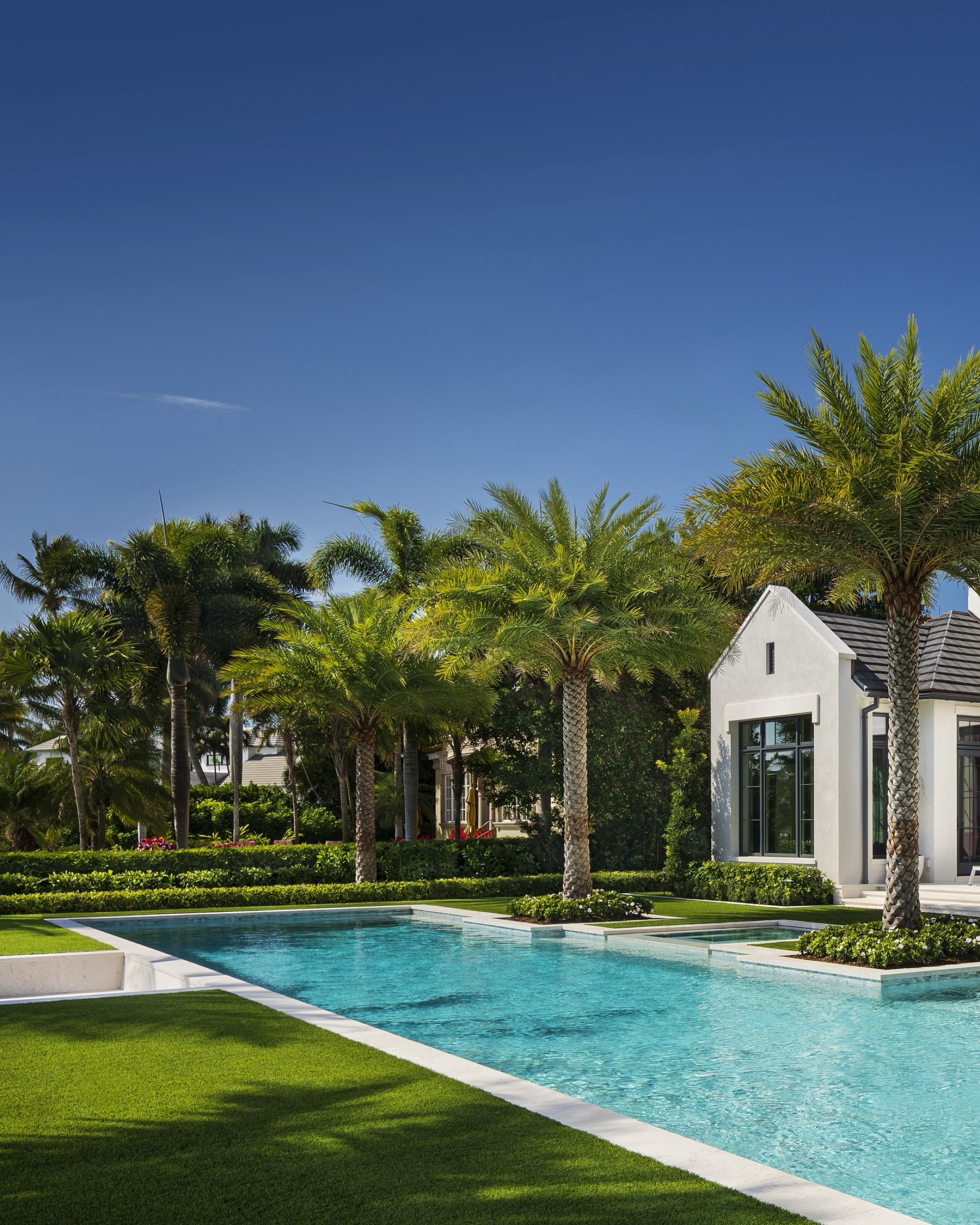 Sunlit architecture. Water that reads like glass. And a backyard that lives like a private resort.
Clean-lined geometry anchors the space, while the extended lap pool stretches the horizon and pulls your eye straight through the property. Layered palms soften the structure, creating that effortless Naples indoor-outdoor rhythm - morning laps, shaded lounging, and evenings that linger a little longer by the water.
Every edge is intentional. Every view is considered. This is what it means to design beyond the home into the lifestyle.
#NaplesLuxury #OutdoorLivingDesign #LuxuryLandscape #FloridaLiving #ResortStyleLiving