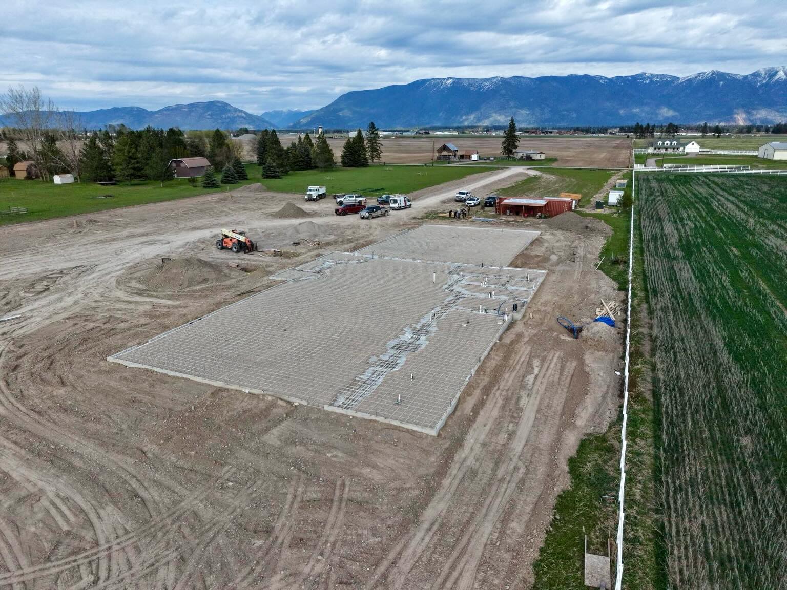 Project Update – Flathead Valley Church Building
May 2026
Over the past couple of months, construction has begun on the Flathead Valley church building project in Kalispell, Montana.
Photo 1: The prep work for the foundation is complete, and it is ready for the concrete pour.
Photo 2: Assembling the mounting hardware for the parking lot light poles. Left to right: Stuart Simonson, Craig Simonson, Von Strand, Devin Simonson, Dane Kangas.
Photo 3: A breaking-ground party to help raise funds for the building project was held at Seth and Nikita McEleney’s land.
Text: Krista Anderson
Photos: Brendan Anderson
The final image is from the April issue of The Voice of Zion