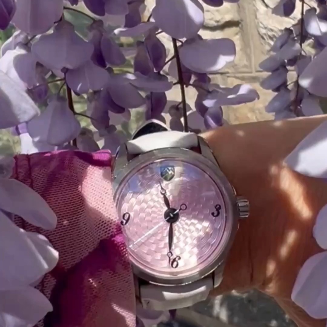 A 36mm Blanca in soft light pink enamel over hand-engraved basketweave guilloché, dancing in the sunlight beneath blooming wisteria.
Delicate from a distance. Full of depth up close.
As the light moves across the dial, the pattern comes alive beneath the enamel, revealing the artistry hidden below the surface. This is the beauty of true Basse-taille. Always changing. Never flat. Never still.
And like the season surrounding it, this piece exists only for a moment.
One of one by design. Made Mile High.
#5280WatchCompany #Blanca #BasseTaille #Guilloche #SpringColors #IndependentWatchmaking #MadeMileHigh #WatchCollectors #ArtisanWatchmaking #OneOfOne