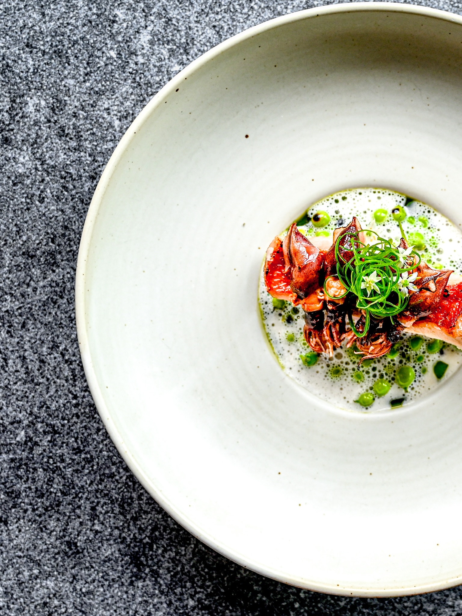 Kinmedai
Firefly squid, green peas
A delicate composition inspired by the softer side of the sea.
The richness of kinmedai meets the gentle iodine depth of firefly squid, balanced by the freshness and sweetness of green peas.
At L’Arôme by the Sea, each course explores a different rhythm of the ocean through a contemporary French approach.
Executive Chef: @chef_max90
Head Chef: @padoy
In-house Photography by L’Arôme by the Sea
#LaromeByTheSea #PhuketFineDining #Kinmedai #FireflySquid #FrenchFineDining