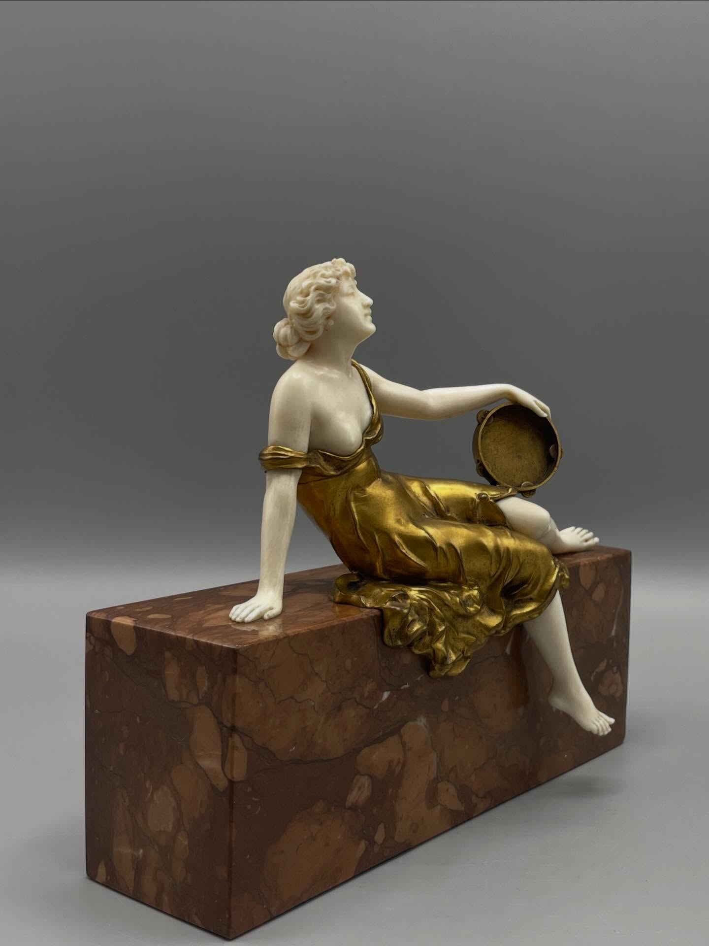 Young Woman with Tambourine, Art Deco Period, Bronze and Ivory
Elegant Art Deco chryselephantine sculpture attributed to Ferdinand Preiss, depicting a young woman with a tambourine gracefully reclining on a veined brown marble base.
The figure is crafted in gilded bronze and ivory, using the chryselephantine technique emblematic of creations from the 1920s and 1930s.
Presented with CITES documentation.
Ferdinand Preiss (1882–1943) was one of the most renowned German sculptors of the Art Deco period. Based in Berlin, he became known for his chryselephantine sculptures combining bronze and ivory, mainly depicting dancers, cabaret performers, and elegant female figures. Inspired by the refined aesthetics of the Roaring Twenties, his works are now highly sought after by Art Deco collectors.#yesterdayknuts #antique #antiquedealersofinstagram #homedecor