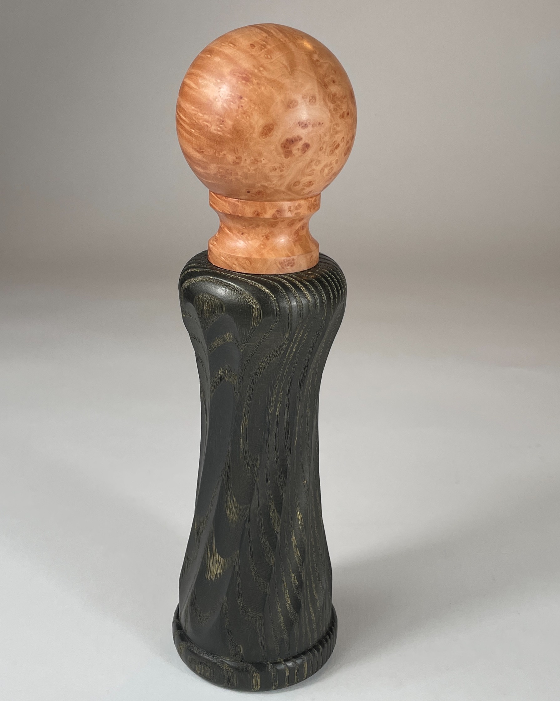 Fluted pepper mill created on the Rose Engine Lathe. The top is Arbutus Burl and the bottom is Ash. Ebonized by burning with a torch, wire brush, India ink, lacquer, gilt cream and more lacquer. The top is finished with tung oil. The mill incorporates the Crush Grind ceramic mill that carries a 25 year mechanism.
@crushgrind_woodturner
darawoodworks.com