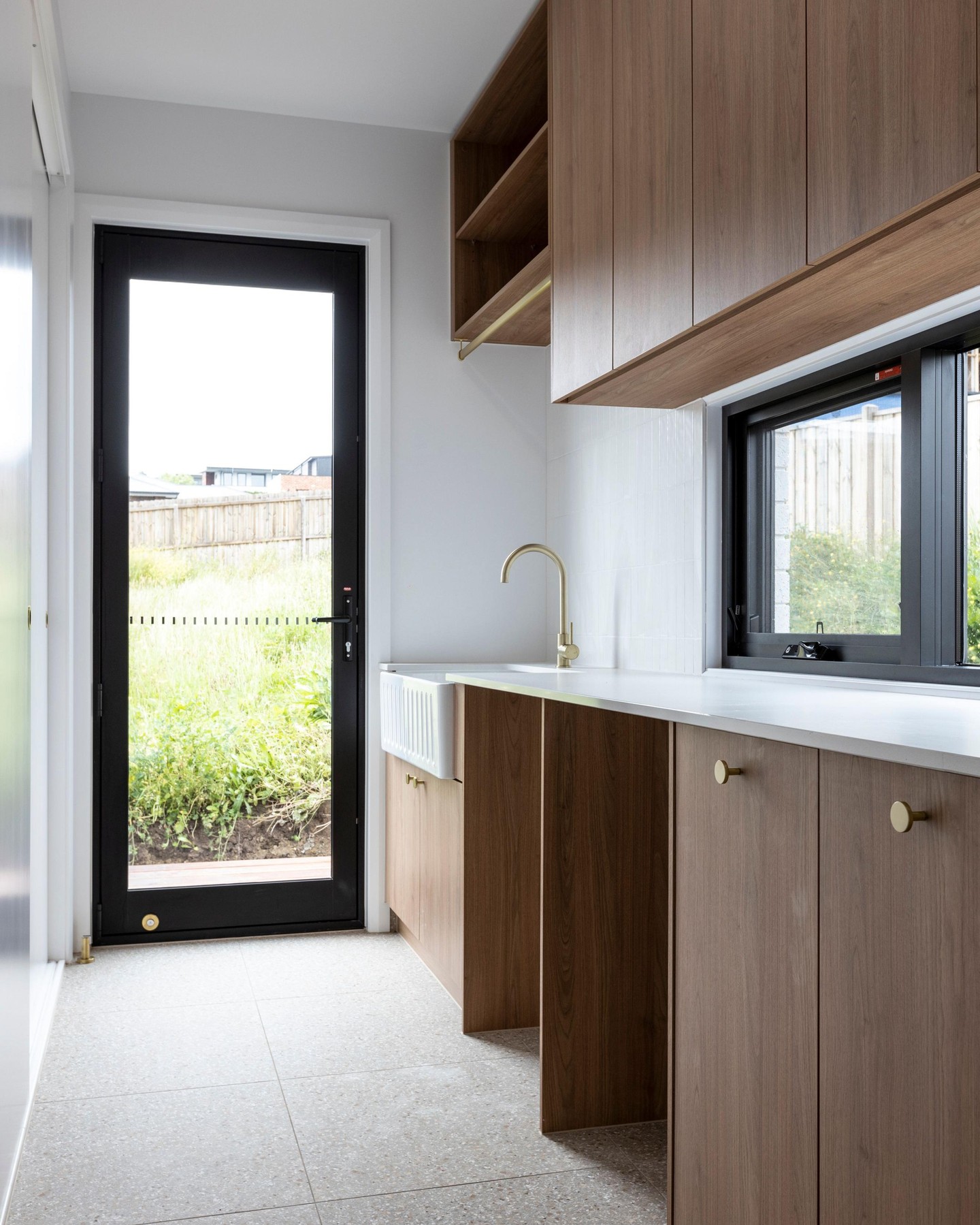 A narrow space, beautifully reimagined. ✨
This mudroom/ Laundry zone is all about smart planning, natural light, and clean finishes.
The timber cabinetry, Brushed brass tapware, and black-framed glazing bring warmth and contrast in just the right way. And connection directly to the yard space for functionality
Want to see more spaces designed with lifestyle in mind? Send us a message. 🏡