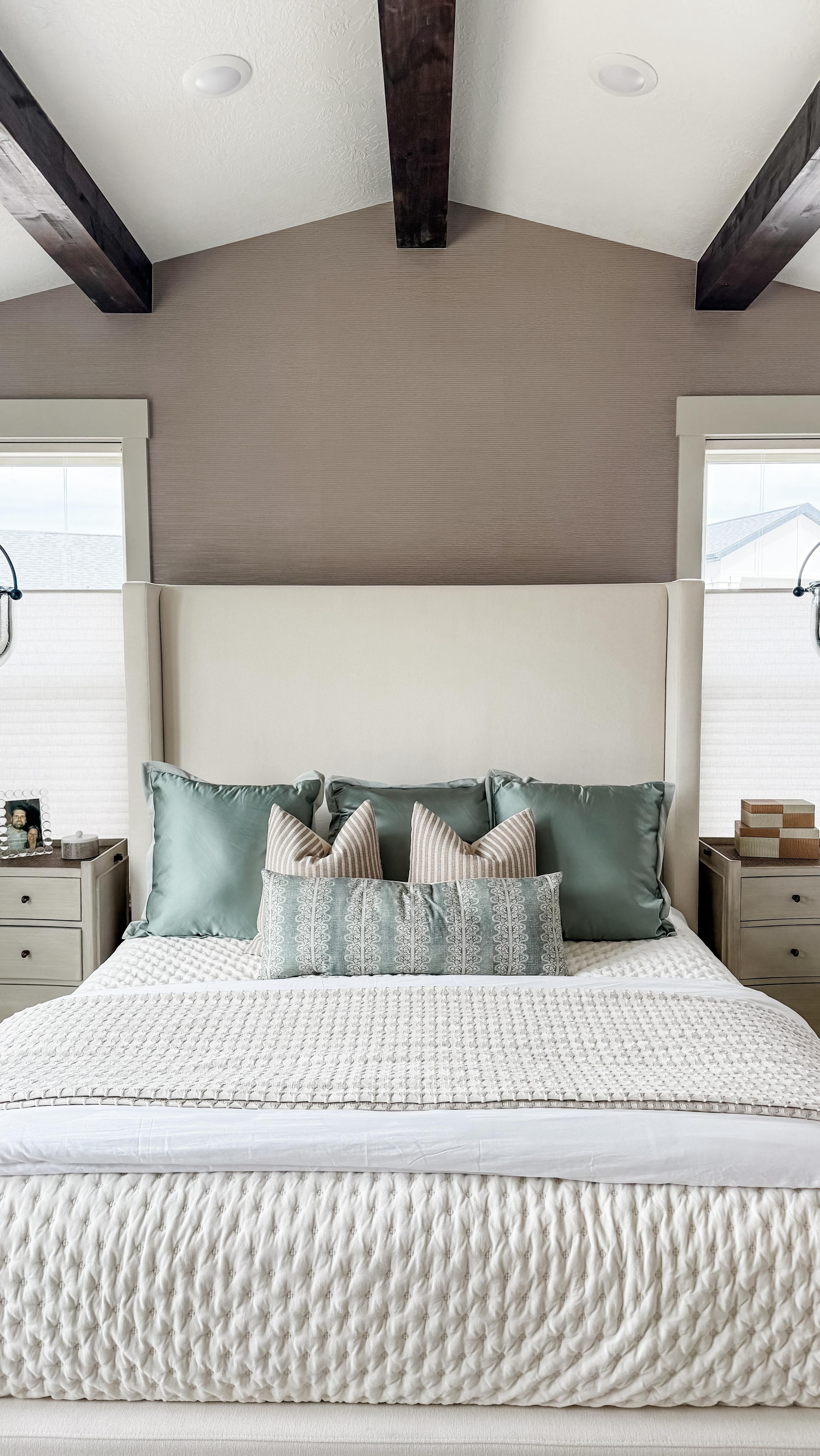 Your bedroom should feel like an exhale at the end of the day, and reflect you!
1. Start with a soft, tonal color palette
Think warm whites, creams, taupes, muted blues, and earthy greens. Keeping the palette calm instantly makes the room feel restful and elevated.
2. Layer textures instead of adding clutter
Linen bedding, a vintage-inspired rug, woven shades, soft throws, wood tones, and upholstered pieces create that collected, cozy feeling without overwhelming the space.
3. Add pieces that make the room feel lived-in
A bench at the end of the bed, stacked books, antique accents, soft lighting, and meaningful décor are what turn a bedroom into a retreat instead of just a place to sleep.
#primarybedroom #masterbedroomdesign #bedroom #bedroominspo #bedroomgoals