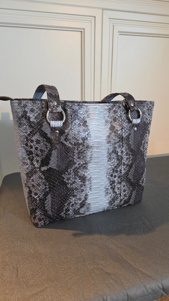 Style Tip: Pair the Julie Tote with a sharp black blazer and trousers for a powerful professional look, or let it be the centerpiece of a simple white tee and denim ensemble.
#custombag #everdaybag #everydaytote #style