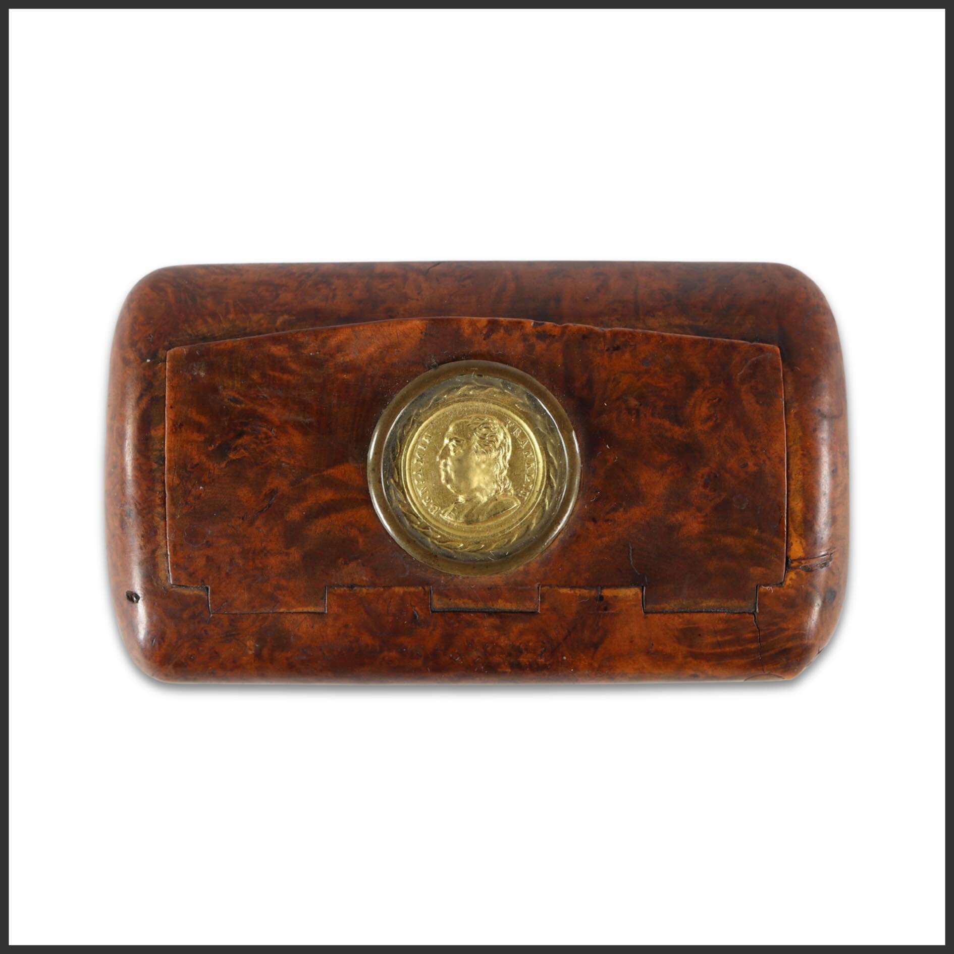 Benjamin Franklin Portrait Burlwood Snuff Box
French, circa 1840
A finely grained burlwood snuff box of gently rounded rectangular form, the lid inset with a glass-covered medallion portrait of Benjamin Franklin. The richly figured surface displays the warm swirling patterns prized in mid-nineteenth-century French decorative arts, while the crisp profile likeness reflects the enduring transatlantic admiration for Franklin as a symbol of Enlightenment intellect and republican virtue.
Objects of this type illustrate Franklin’s lasting international reputation in the decades following the American Revolution, particularly in France, where he remained one of the most celebrated figures associated with the American cause and the ideals of the Enlightenment.
Now available from Gallery 76 Americana.
#Gallery76Americana #BenjaminFranklin #Americana #HistoricalAmericana #FrenchDecorativeArts