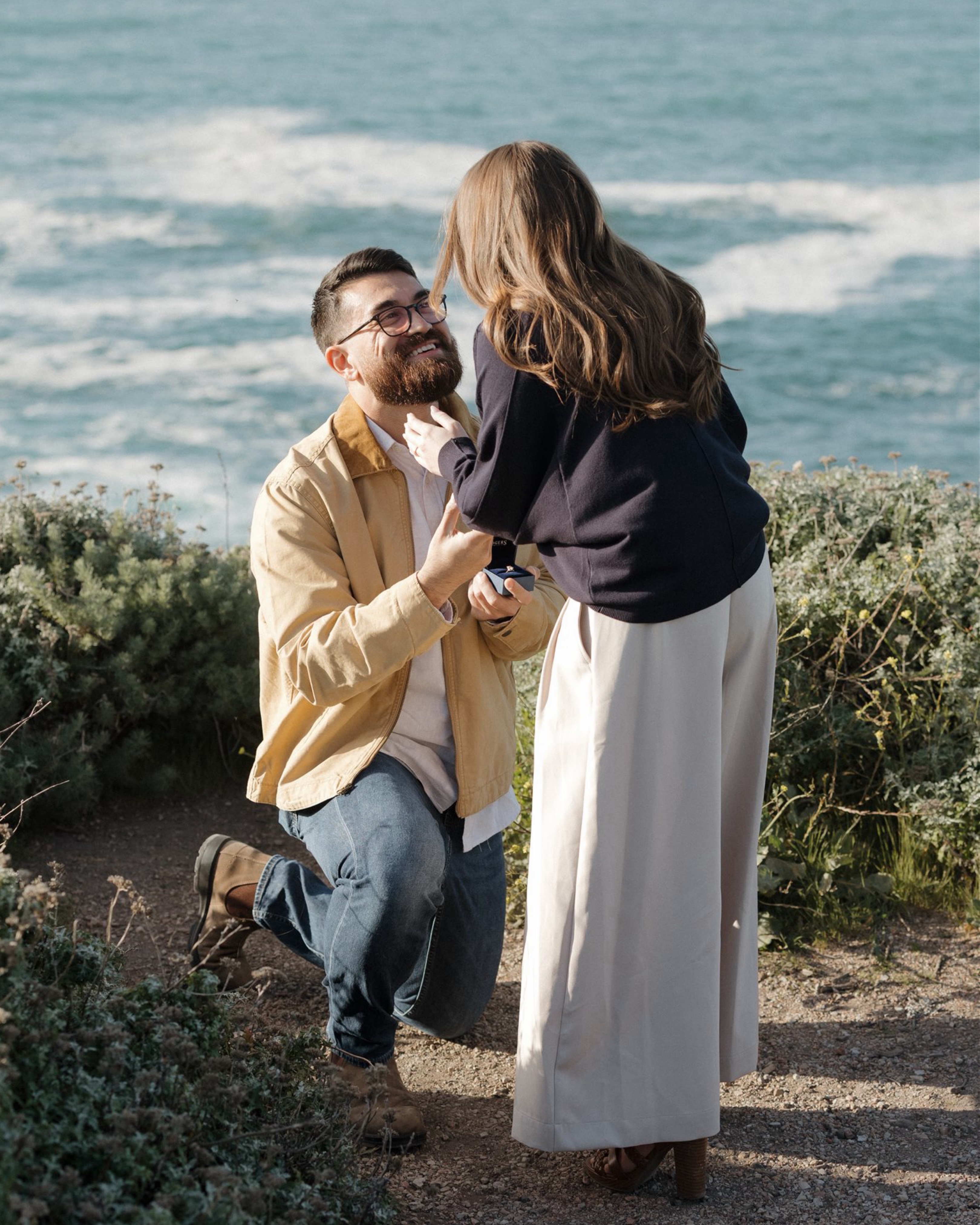 The best proposals always feel a little like them!
For Zachary and Rhiannon, that meant ocean views, quiet trails, and a sunset at Montaña de Oro.
They met at the gym after months of noticing each other — until one day Rhiannon jokingly called him out for always wearing a hat and “catfishing” everyone by hiding his hair. 😂
Six years later, they stood above Spooner’s Cove on the Bluff Trail while Zachary asked one of the biggest questions of their lives.
Afterward, we wandered the cliffs and trails together while the sun dropped over the coastline.
Playful. Relaxed. Intentional.
Exactly how a proposal should feel. 🤍
If you’re thinking about proposing on the Central Coast, Montaña de Oro continues to be one of my favorite places for intimate proposals and engagement photos. I support you through the entire process! Their proposal is now on the blog!
#proposalphotographer #centralcoastphotographer #montañadeoro #proposalplanning