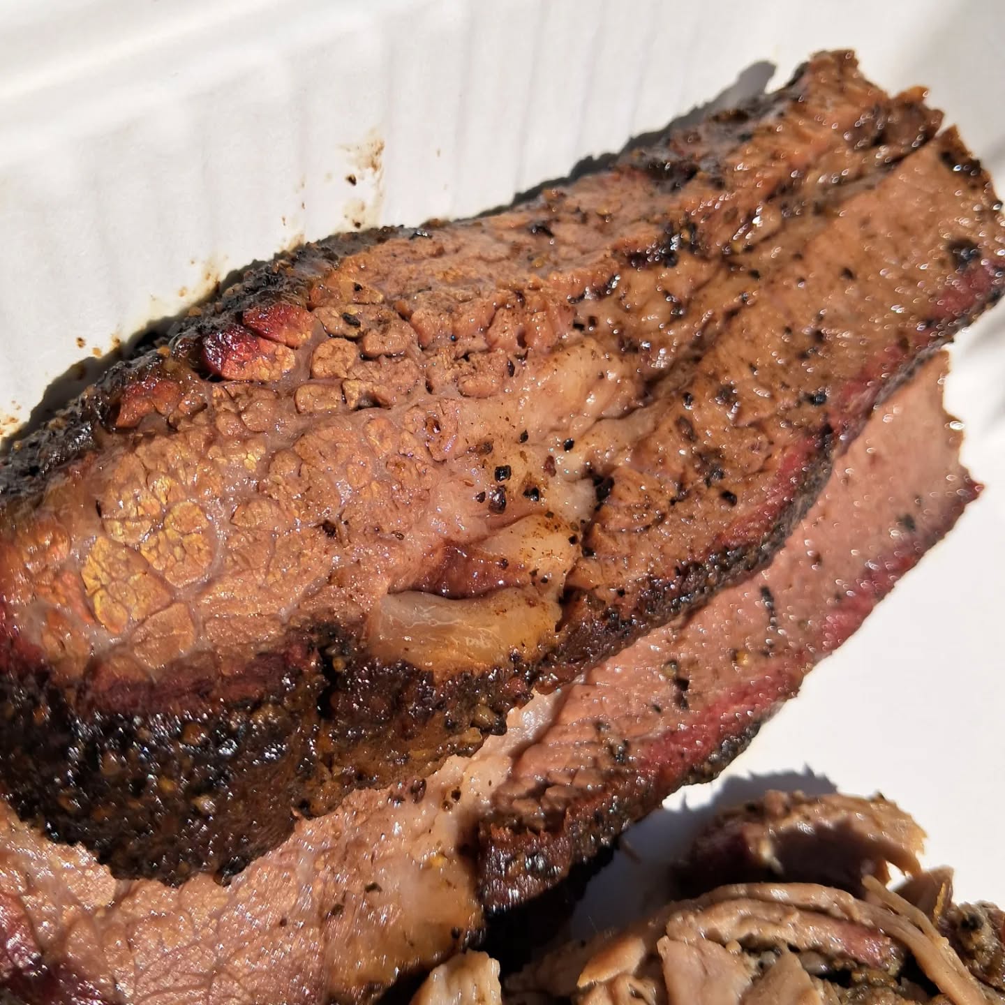 Finally made it to @metamodern_bbq ! That brisket tho....stellar and juicy. There's so much to try at this LNK based truck. I started with two of the staples, brisket and pulled pork in 1/4lb increments and both were very good. They functioned well on their own and also with Meta's Red and also their Gold sauces.
I had to get some fun out of the box items too because Meta is doing things on that truck. I got a brisket egg roll that was fried up super fresh, ginger forward and stuffed with brisket. Then my favorite of the two the Elote Fritters. I expected a spherical delivery device, but got tasty triangles instead. They were soft in the middle, flavorful and topped with green sauce and crema. The key bite though is the acute angle of that triangle as it is more crisp and delivers the most delicious.
Thanks Meta Modern BBQ, I appreciate you (and those directions to your lunch stop).
Have a great day and remember to Connect With Food!