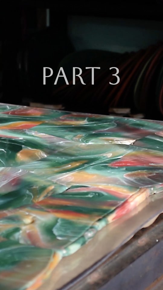 OUR LDPE PLASTIC RECYCLING PROCESS - PART 3
After the colour mixing and layering stages (PART 2), we then hand marble and shape the individual masses of plastic - they’re 150°C (302°F) so this is pretty hot work!
In 2023 we designed our second large hydraulic press, which can press up to 1200 x 2400mm sheets. For this piece, it took 24 parts, of various weights and shapes, all placed on the bed of the press in a specific formation.
Whilst we’re marbling and shaping, we pre-heat the top and bottom beds of the press using silicone heatmats, which we remove just before the press. Then it’s go-go-go to get the plastic from the ovens onto the bottom bed: the plastic starts cooling down as soon as it leaves the oven, and because the plastic flows best when it’s fully melted, this needs to happen as quickly as possible.
The press is easily the most nerve wracking part of our process, as all the hours of prep lead up to this moment, and if anything goes wrong or takes too long, the sheet could be ruined!
Once all the plastic is on, we lower the top bed and apply pressure with hydraulic jacks, until we reach the desired thickness. The pressure squishes all the separate masses of plastic, until eventually they meet each other and fuse to form a full sheet.
After it’s cooled down, it’s time to reveal the sheet. Even though we plan meticulously, it’s always a heart-racing moment to see how it’s turned out, because a lot of the magic happens in the press!
The geometry that is created from where all the masses of plastic have fused together, adds such a unique character to each piece - it really reminds us of cubist paintings, where the colours fade and either match up or contrast where they meet along straight lines.
Finally, we cut and finish all our pieces using common workshop machinery like circular saws, orbital sanders, routers and hand planes.
For this bespoke piece, our client made this stunning wooden table himself to fit our sheet of recycled plastic as an inlay. The wood-plastic combination turned out so beautifully and we love the colours he chose!
#recycledplastic
#sustainablemarble
#satisfyingprocess
#sustainablematerial
#ecofrie