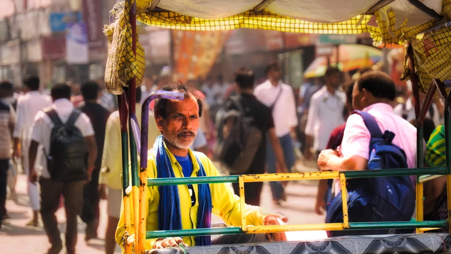 While the beautiful chaos of the city rushes by in a blur, he sits quietly in his rickshaw, an anchor of stillness in the crowd.
His steady, tired eyes reflect a lifetime of hard work as he silently observes the endless parade of travelers.
It's a humbling reminder that the true heart of our journey lies not in the monuments we visit, but in the people who keep the city moving.
#tournival #varanasi #kashi #citylife #banaras