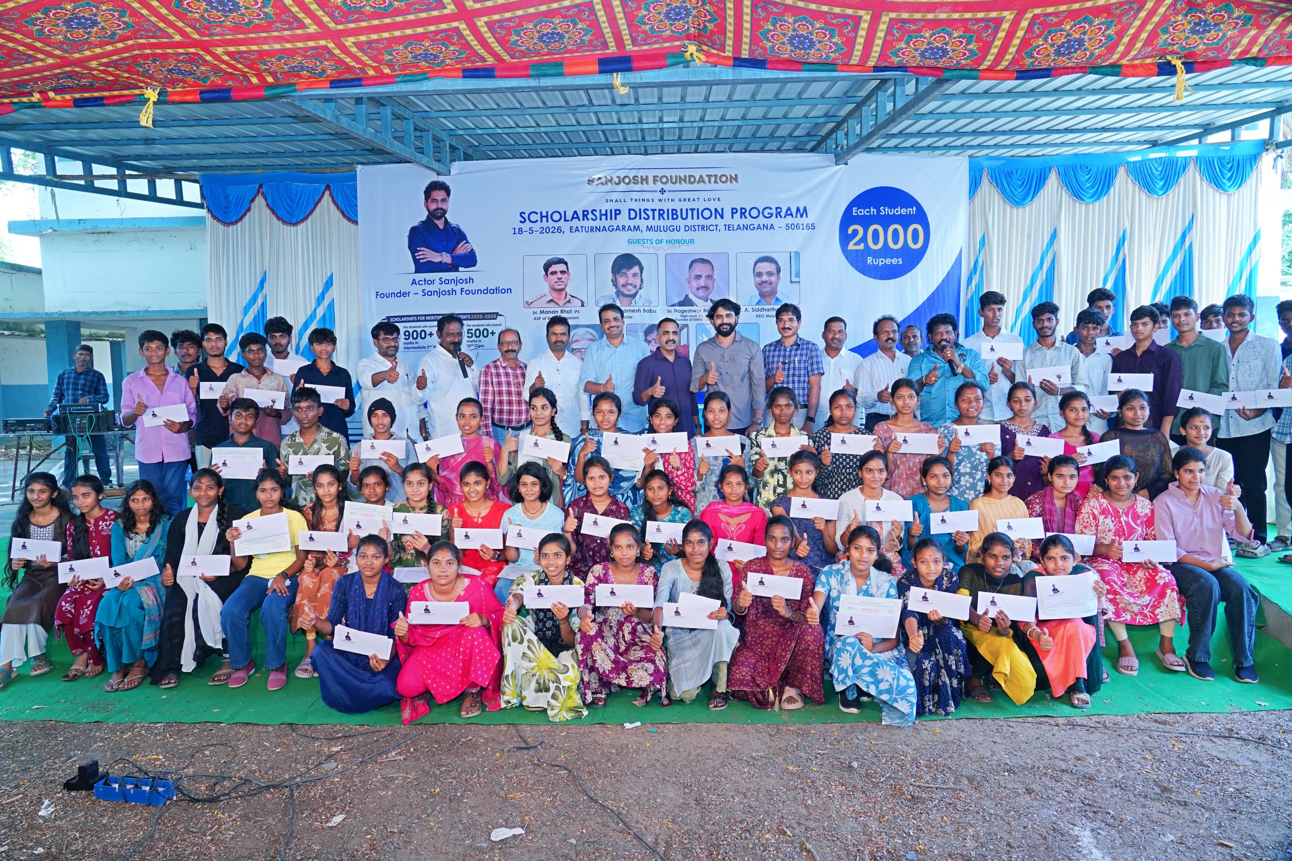 Small Hero, Big Help
Actor Sanjosh Continues His Service to Students and Tribal Communities
Actor Sanjosh, known for his roles in the Telugu films BEWARS and SODHARA, successfully organized a Scholarship Distribution Program through the SANJOSH FOUNDATION on 18-05-2026 at Eturnagaram.
As part of this noble initiative, scholarships were provided to 118 tribal and below middle-class students from Mulugu district who achieved more than 500 marks in 10th Class and above 900 marks in Intermediate. Each student received a cash scholarship of ₹2,000 to support their education and encourage them toward a brighter future.
Popular comedian and actor Sampoornesh Babu attended the event as the chief guest and delivered an inspiring motivational speech to the students, encouraging them to dream big and work hard for success.
The event was graced by several respected dignitaries, including Manan Bhat IPS ( ASP of Eturnagaram)
Pujari Nageshwar Rao, (ADVOCATE )
DEO Siddharth Reddy, and MEO Mallik. All the guests appreciated actor Sanjosh for his continuous charitable activities and dedication toward social service.
Apart from scholarship programs, Sanjosh has actively worked for tribal welfare and government school students through the SANJOSH FOUNDATION. Earlier, he organized 168 free mobile eye cataract surgeries for tribal people living in remote areas. He is also personally supporting the education of three students and regularly providing ties, belts, shoes, and exam kits to government school and college students.
Many people across the region are appreciating the young actor’s commitment to helping underprivileged communities and inspiring students through education and social service. Through the SANJOSH FOUNDATION, actor Sanjosh aims to continue supporting deserving students and tribal communities in the coming years.
#inspiration #education #foundation #study #helping
