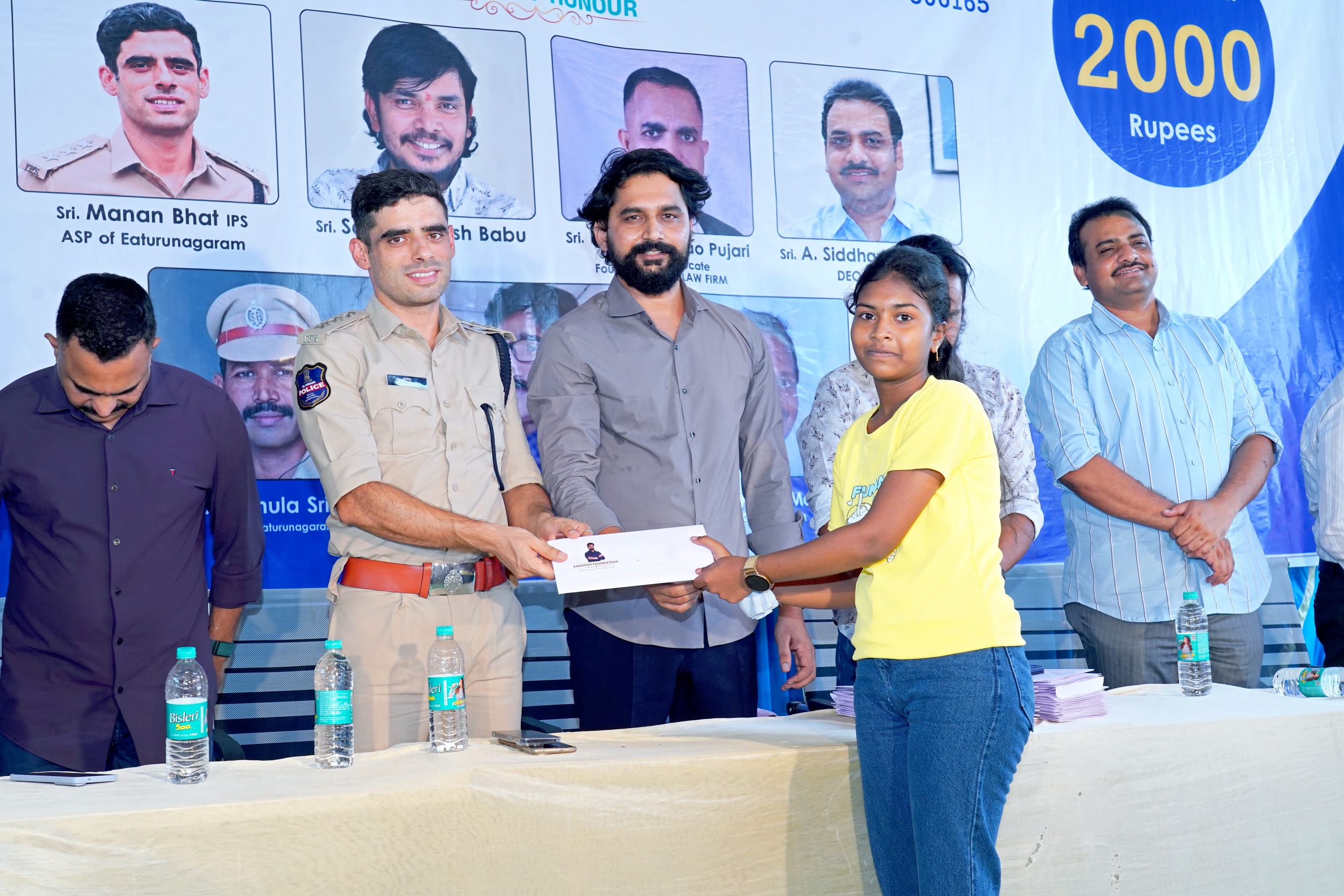 Small Hero, Big Help
Actor Sanjosh Continues His Service to Students and Tribal Communities
Actor Sanjosh, known for his roles in the Telugu films BEWARS and SODHARA, successfully organized a Scholarship Distribution Program through the SANJOSH FOUNDATION on 18-05-2026 at Eturnagaram.
As part of this noble initiative, scholarships were provided to 118 tribal and below middle-class students from Mulugu district who achieved more than 500 marks in 10th Class and above 900 marks in Intermediate. Each student received a cash scholarship of ₹2,000 to support their education and encourage them toward a brighter future.
Popular comedian and actor Sampoornesh Babu attended the event as the chief guest and delivered an inspiring motivational speech to the students, encouraging them to dream big and work hard for success.
The event was graced by several respected dignitaries, including Manan Bhat IPS ( ASP of Eturnagaram)
Pujari Nageshwar Rao, (ADVOCATE )
DEO Siddharth Reddy, and MEO Mallik. All the guests appreciated actor Sanjosh for his continuous charitable activities and dedication toward social service.
Apart from scholarship programs, Sanjosh has actively worked for tribal welfare and government school students through the SANJOSH FOUNDATION. Earlier, he organized 168 free mobile eye cataract surgeries for tribal people living in remote areas. He is also personally supporting the education of three students and regularly providing ties, belts, shoes, and exam kits to government school and college students.
Many people across the region are appreciating the young actor’s commitment to helping underprivileged communities and inspiring students through education and social service. Through the SANJOSH FOUNDATION, actor Sanjosh aims to continue supporting deserving students and tribal communities in the coming years.
#inspiration #education #foundation #study #helping