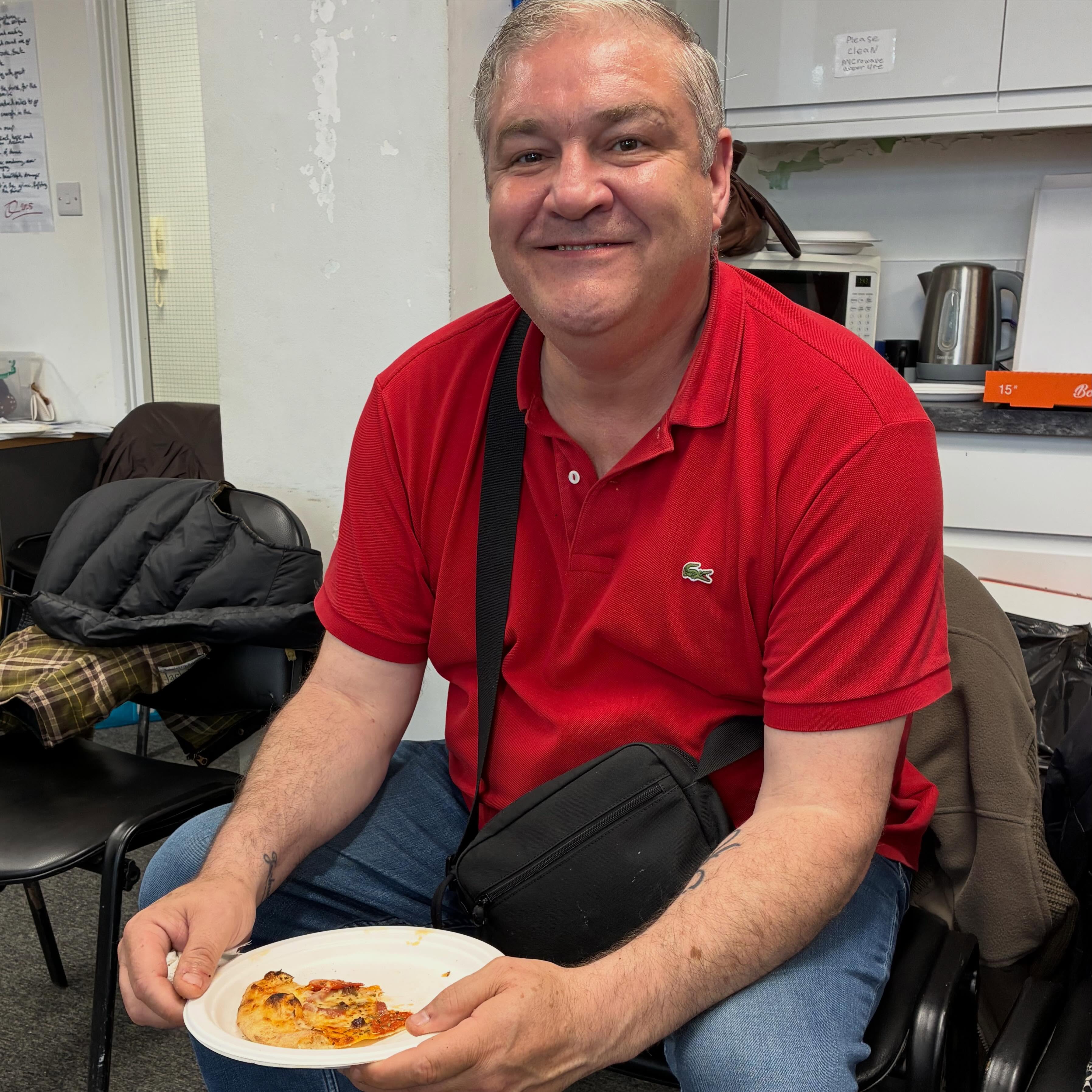 Jason clearly enjoying his pizza