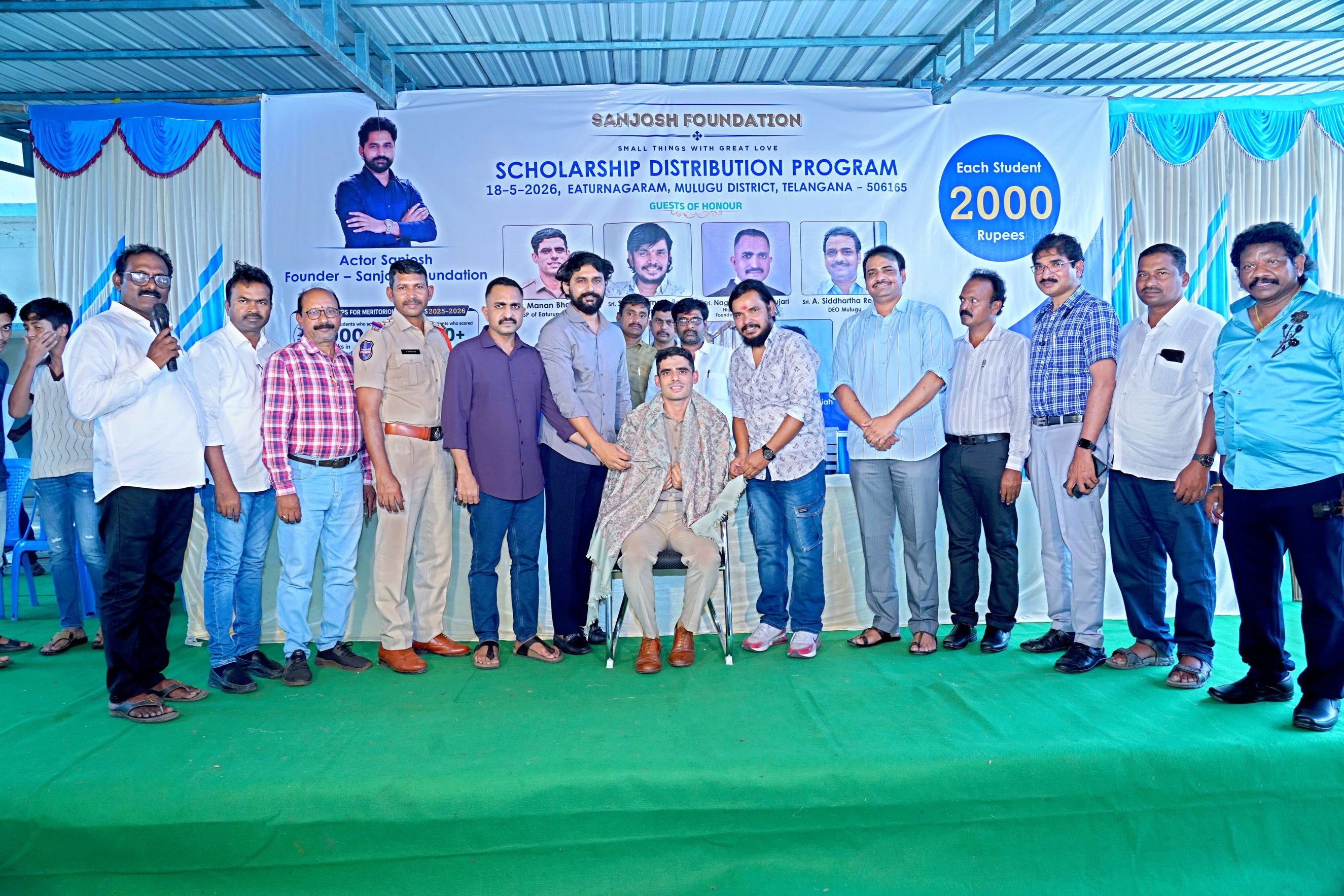 Small Hero, Big Help
Actor Sanjosh Continues His Service to Students and Tribal Communities
Actor Sanjosh, known for his roles in the Telugu films BEWARS and SODHARA, successfully organized a Scholarship Distribution Program through the SANJOSH FOUNDATION on 18-05-2026 at Eturnagaram.
As part of this noble initiative, scholarships were provided to 118 tribal and below middle-class students from Mulugu district who achieved more than 500 marks in 10th Class and above 900 marks in Intermediate. Each student received a cash scholarship of ₹2,000 to support their education and encourage them toward a brighter future.
Popular comedian and actor Sampoornesh Babu attended the event as the chief guest and delivered an inspiring motivational speech to the students, encouraging them to dream big and work hard for success.
The event was graced by several respected dignitaries, including Manan Bhat IPS ( ASP of Eturnagaram)
Pujari Nageshwar Rao, (ADVOCATE )
DEO Siddharth Reddy, and MEO Mallik. All the guests appreciated actor Sanjosh for his continuous charitable activities and dedication toward social service.
Apart from scholarship programs, Sanjosh has actively worked for tribal welfare and government school students through the SANJOSH FOUNDATION. Earlier, he organized 168 free mobile eye cataract surgeries for tribal people living in remote areas. He is also personally supporting the education of three students and regularly providing ties, belts, shoes, and exam kits to government school and college students.
Many people across the region are appreciating the young actor’s commitment to helping underprivileged communities and inspiring students through education and social service. Through the SANJOSH FOUNDATION, actor Sanjosh aims to continue supporting deserving students and tribal communities in the coming years.
#inspiration #education #foundation #study #helping