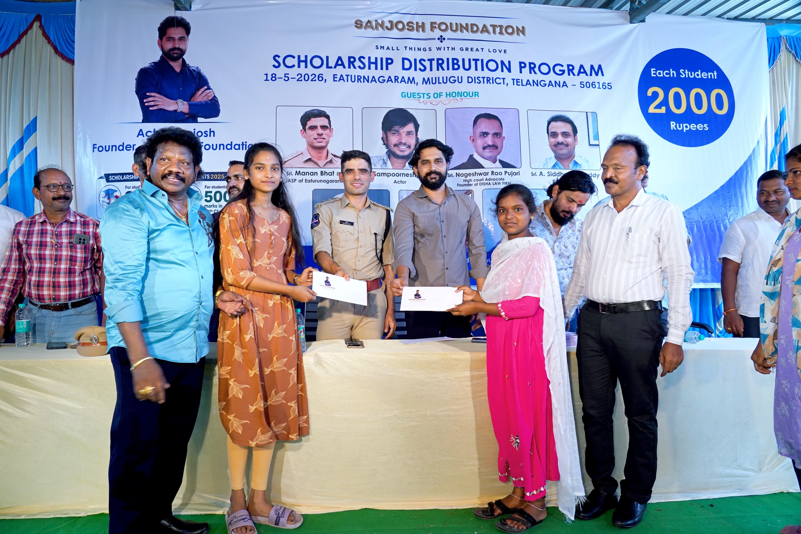 Small Hero, Big Help
Actor Sanjosh Continues His Service to Students and Tribal Communities
Actor Sanjosh, known for his roles in the Telugu films BEWARS and SODHARA, successfully organized a Scholarship Distribution Program through the SANJOSH FOUNDATION on 18-05-2026 at Eturnagaram.
As part of this noble initiative, scholarships were provided to 118 tribal and below middle-class students from Mulugu district who achieved more than 500 marks in 10th Class and above 900 marks in Intermediate. Each student received a cash scholarship of ₹2,000 to support their education and encourage them toward a brighter future.
Popular comedian and actor Sampoornesh Babu attended the event as the chief guest and delivered an inspiring motivational speech to the students, encouraging them to dream big and work hard for success.
The event was graced by several respected dignitaries, including Manan Bhat IPS ( ASP of Eturnagaram)
Pujari Nageshwar Rao, (ADVOCATE )
DEO Siddharth Reddy, and MEO Mallik. All the guests appreciated actor Sanjosh for his continuous charitable activities and dedication toward social service.
Apart from scholarship programs, Sanjosh has actively worked for tribal welfare and government school students through the SANJOSH FOUNDATION. Earlier, he organized 168 free mobile eye cataract surgeries for tribal people living in remote areas. He is also personally supporting the education of three students and regularly providing ties, belts, shoes, and exam kits to government school and college students.
Many people across the region are appreciating the young actor’s commitment to helping underprivileged communities and inspiring students through education and social service. Through the SANJOSH FOUNDATION, actor Sanjosh aims to continue supporting deserving students and tribal communities in the coming years.
#inspiration #education #foundation #study #helping