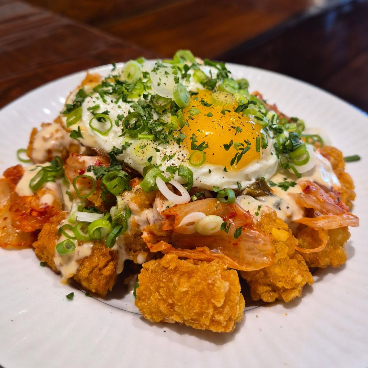 "We will never have a deep fryer here!" I think those were the words I said! But a Dutch oven full of beef tallow is different! New to the menu, loaded tater tots, smothered with our umami aioli, kimchi, and a fried egg. Just saying!