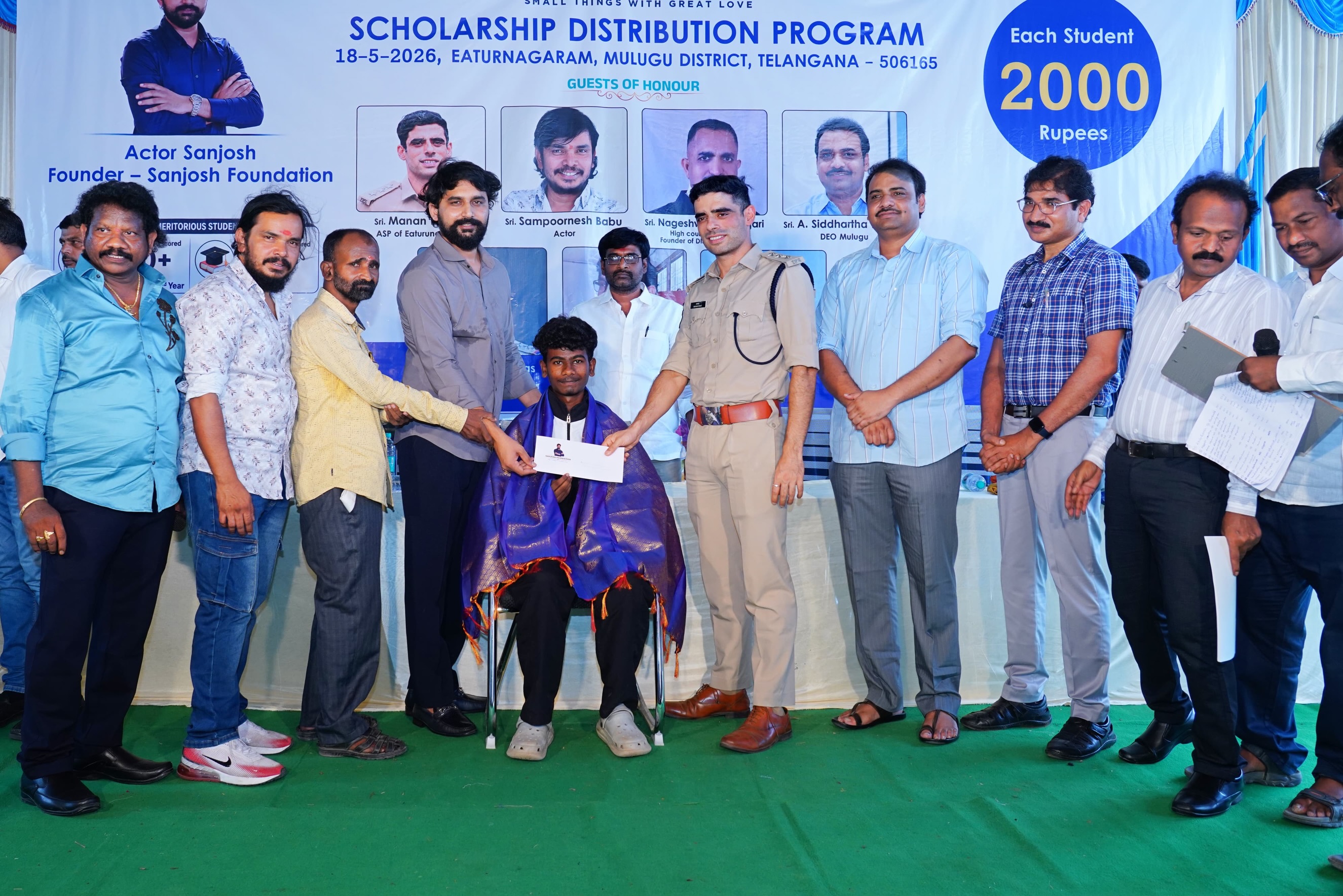 Small Hero, Big Help
Actor Sanjosh Continues His Service to Students and Tribal Communities
Actor Sanjosh, known for his roles in the Telugu films BEWARS and SODHARA, successfully organized a Scholarship Distribution Program through the SANJOSH FOUNDATION on 18-05-2026 at Eturnagaram.
As part of this noble initiative, scholarships were provided to 118 tribal and below middle-class students from Mulugu district who achieved more than 500 marks in 10th Class and above 900 marks in Intermediate. Each student received a cash scholarship of ₹2,000 to support their education and encourage them toward a brighter future.
Popular comedian and actor Sampoornesh Babu attended the event as the chief guest and delivered an inspiring motivational speech to the students, encouraging them to dream big and work hard for success.
The event was graced by several respected dignitaries, including Manan Bhat IPS ( ASP of Eturnagaram)
Pujari Nageshwar Rao, (ADVOCATE )
DEO Siddharth Reddy, and MEO Mallik. All the guests appreciated actor Sanjosh for his continuous charitable activities and dedication toward social service.
Apart from scholarship programs, Sanjosh has actively worked for tribal welfare and government school students through the SANJOSH FOUNDATION. Earlier, he organized 168 free mobile eye cataract surgeries for tribal people living in remote areas. He is also personally supporting the education of three students and regularly providing ties, belts, shoes, and exam kits to government school and college students.
Many people across the region are appreciating the young actor’s commitment to helping underprivileged communities and inspiring students through education and social service. Through the SANJOSH FOUNDATION, actor Sanjosh aims to continue supporting deserving students and tribal communities in the coming years.
#inspiration #education #foundation #study #helping