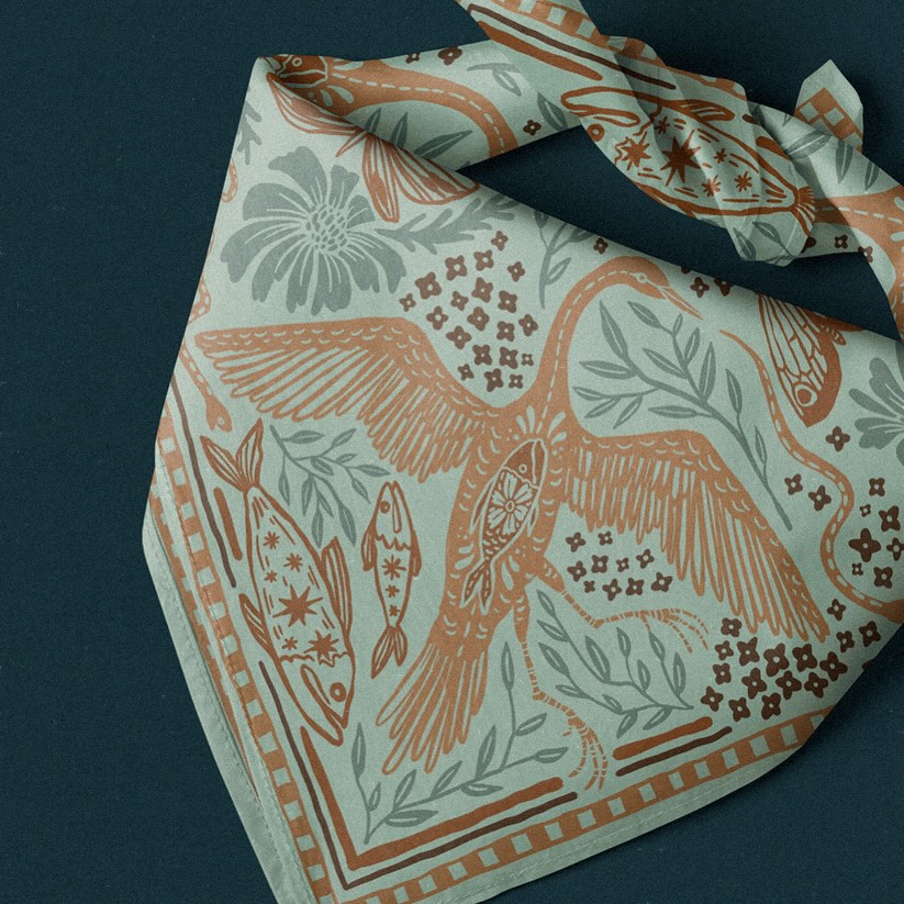 A new bandana design inspired by marshlands, migration, and old American folk illustrations. Great blue herons, moths, winding snakes, wildflowers, and celestial fish all woven together into one flowing pattern.
I wanted this one to feel sun-faded, storied, and a little dreamlike — like something found in an old tackle box or passed down through generations. This design is currently available for licensing! Contact me if you’d like more information.
#bandanadesign #folkart #americana #textiledesign #surfacepattern