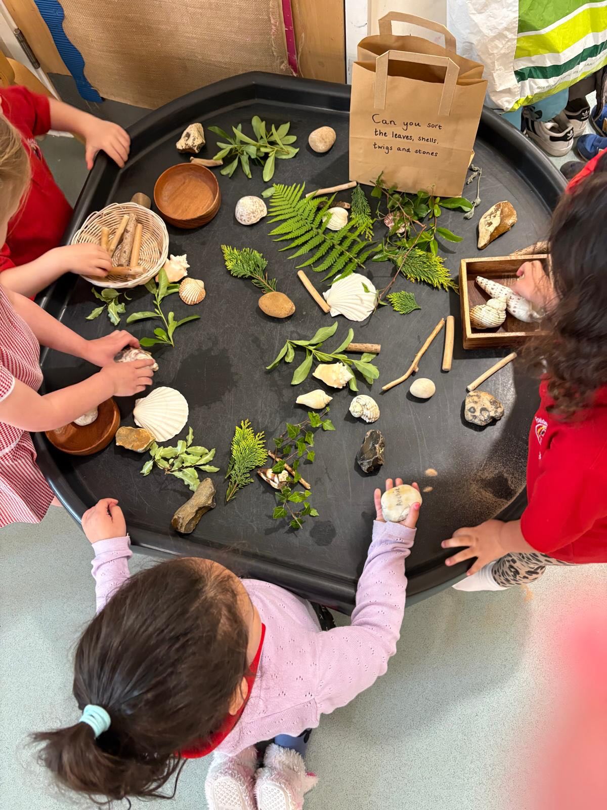 Can you sort the leaves, shells, twigs and stones?
That’s what we asked the children when we introduced this beautiful tray of natural materials and off they went! Sorting, grouping, touching and exploring…hard, soft, smooth, rough, big, small.
This kind of activity is introducing early maths, language development, sensory exploration and a growing interest in the natural world. All from a tray of things you might find on a walk.
Next time you are out, keep your eyes open. A handful of leaves, a few stones, an interesting twig and little a curiosity is all you need...