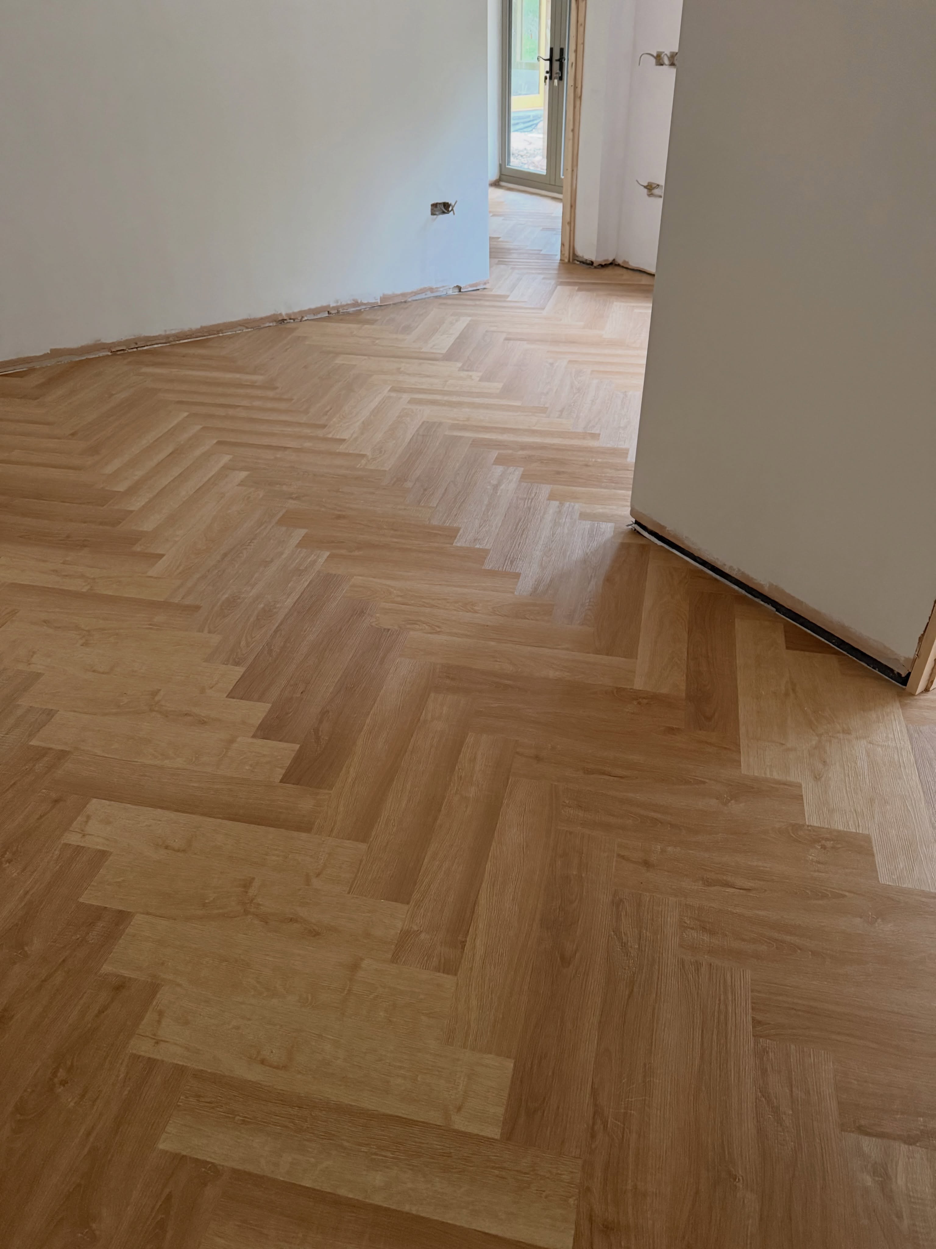 Barely Oak SPC herringbone flooring