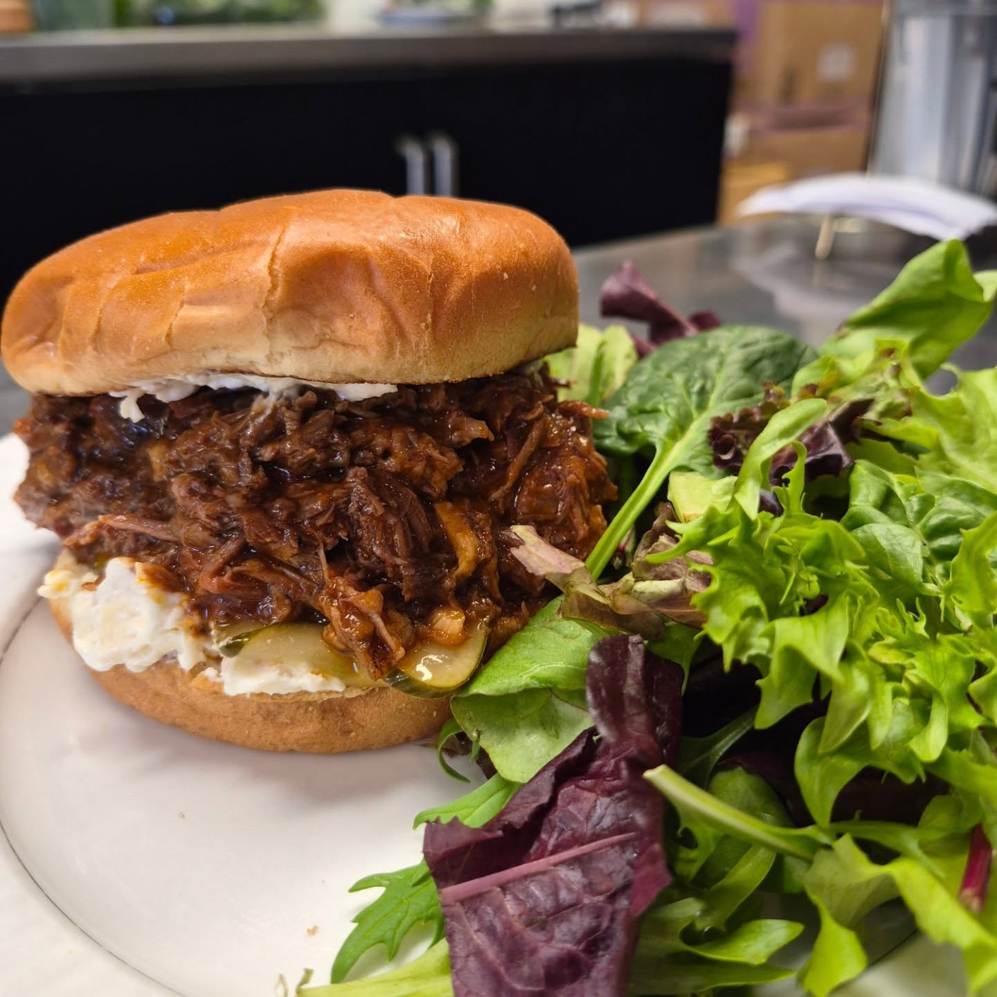 Slow braised Wagyu Beef sandwich with whipped Mt. Tam cheese and house made pickles!