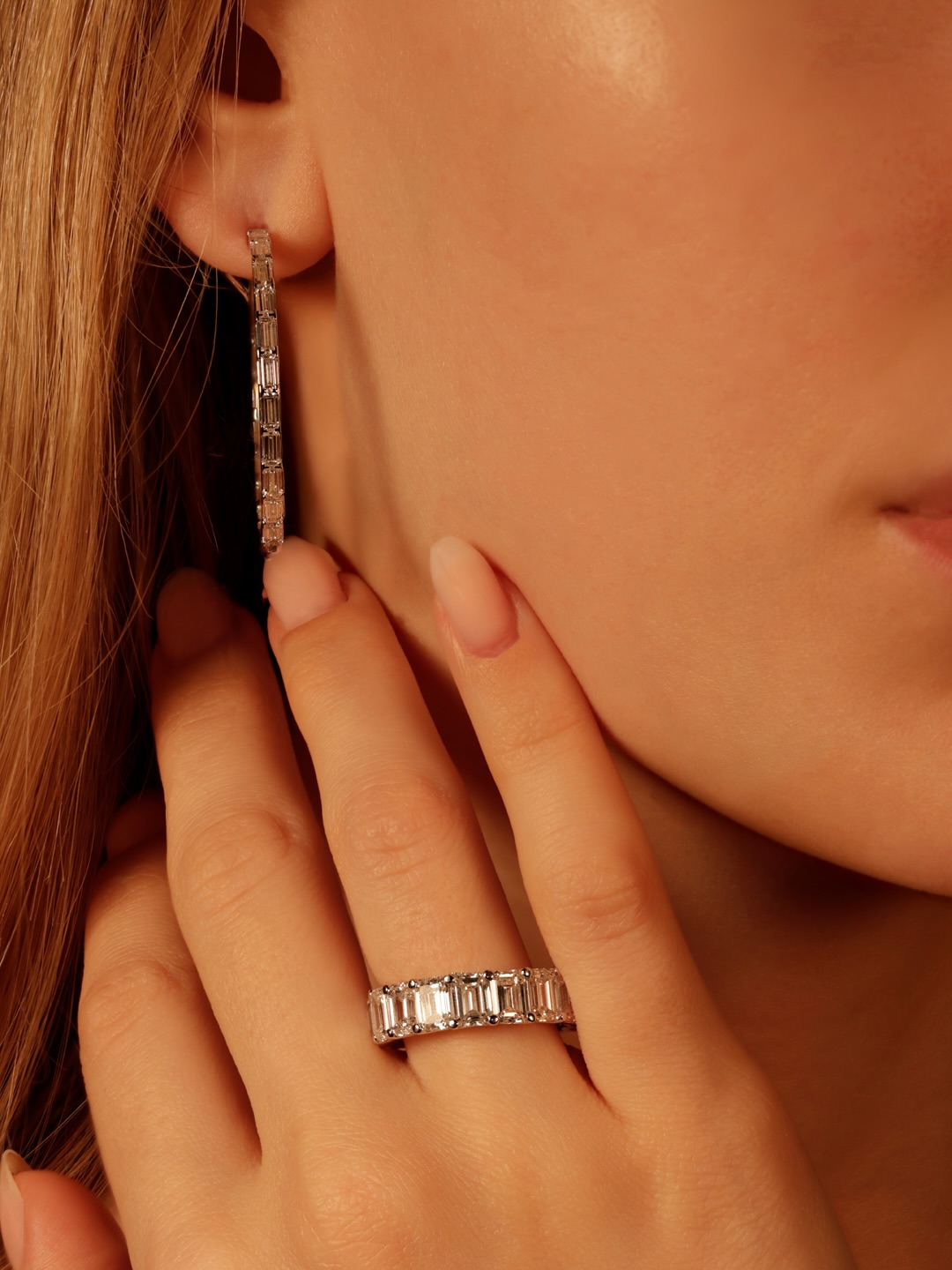 The baguette cut changes everything about a hoop earring. Long, clean, architectural lines that follow the curve of the gold in one continuous movement, a presence that is entirely its own.
The baguette is not a stone designed for maximum brilliance. It has fewer facets than a round brilliant, fewer surfaces to refract and return light. What it produces instead is a different kind of presence, a long, flat gleam that catches light in one continuous movement rather than a thousand separate flashes. Set into a hoop, where the stones must follow a curve, each rectangular face tilts slightly against the next, creating a surface that reads as one unbroken line of light all the way around.
42 baguette-cut diamonds in F-SI, 4.00 carats total, set into 18-carat white gold hoops of 3.5 centimetres diameter. 10.1 grams for the pair, a weight that is felt, a presence that is unmistakable. The kind of earring that does not need anything else on the ear to justify itself.
By private appointment only.
The BrandZ — A Luxury Experience.
#thebrandz